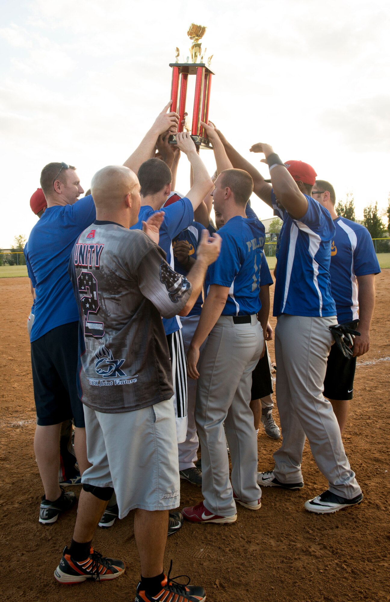 Airmen from the 705th Munitions Squadron hold up their trophy at Minot Air Force Base, N.D., Aug. 26, 2014. The Airmen competed against a group of Airmen from the 5th Logistics Readiness Squadron, and defeated them, for the title of intramural softball champions. (U.S. Air Force photo/Airman 1st Class Sahara L. Fales)