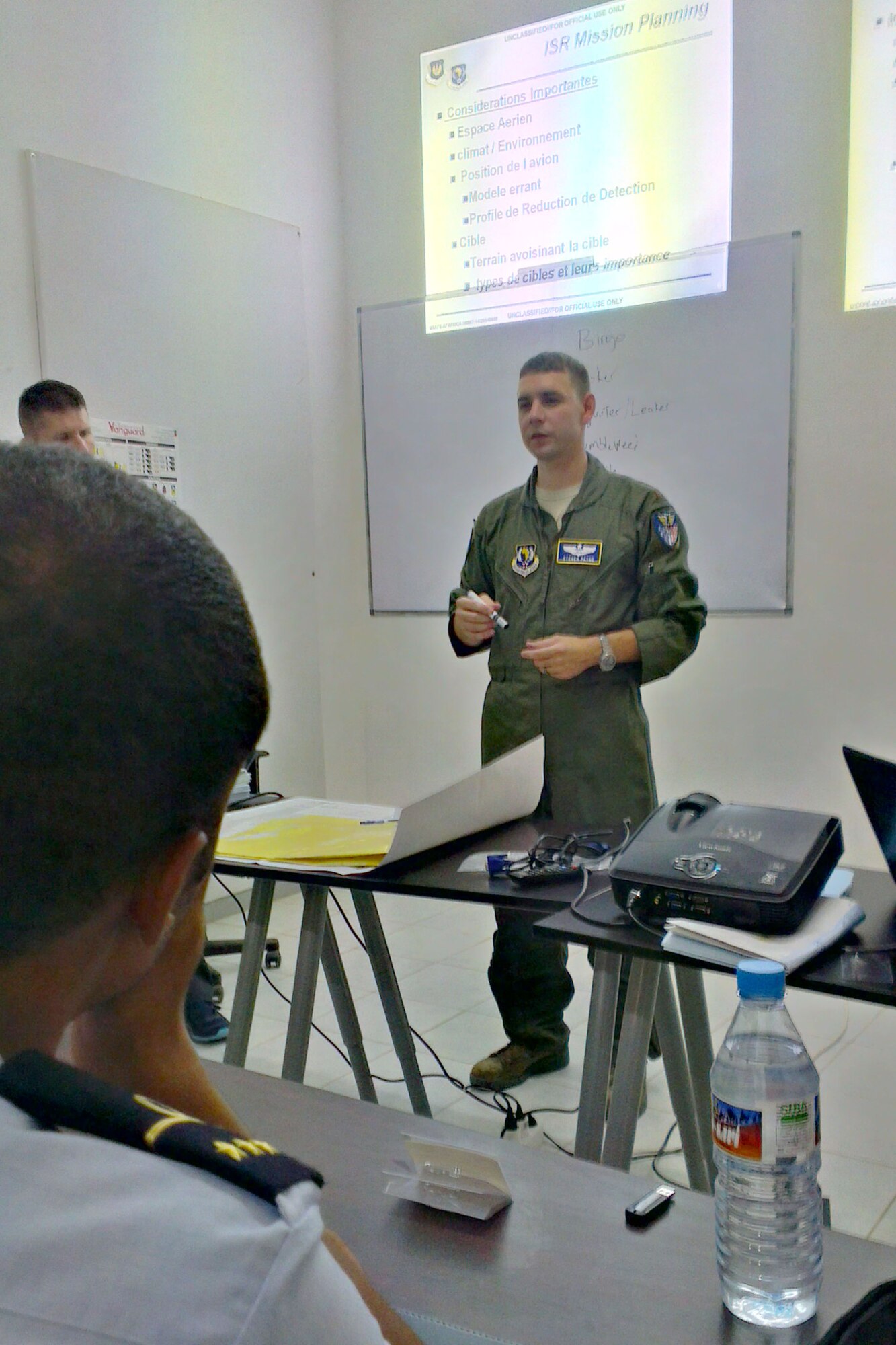 U.S. Air Force Maj. Steve Payne, Intelligence, Surveillance, Reconnaissance mission planning instructor from U.S. Air Forces in Europe and Air Forces Africa, teaches a lesson to students about ISR mission planning during African Partnership Flight, Sept. 2, 2014. APF is the premier program for building aviation capacity, enhancing regional cooperation, and increasing U.S. and African interoperability. (U.S. Air Force photo/Master Sgt. Brian Boisvert/Released)