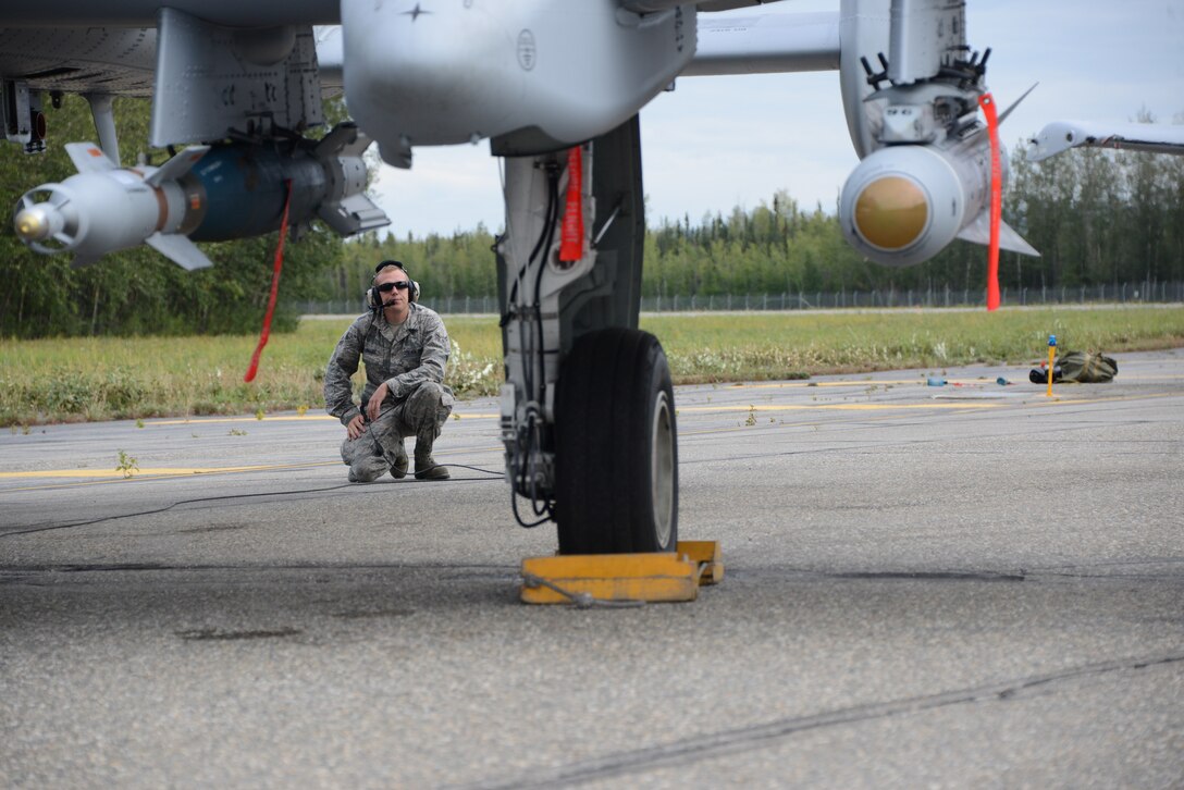 Airman 1st Class Richard Miller, A-10 Crew Chief, 175th Maintenance Squadron, Maryland Air National Guard, looks over an A-10C Thunderbolt II during the pre-flight inspection process at Exercise Red Flag – Alaska 14-3, Eielson Air Force Base, Ak. Exercise Red Flag – Alaska is a 10 day exercise that is a series of Pacific Air Forces commander-directed field training exercises for U.S. forces, provides joint offensive counter-air, interdiction, close air support, and large force employment training in a simulated combat environment. (Air National Guard photo by Tech. Sgt. Christopher Schepers/RELEASED)