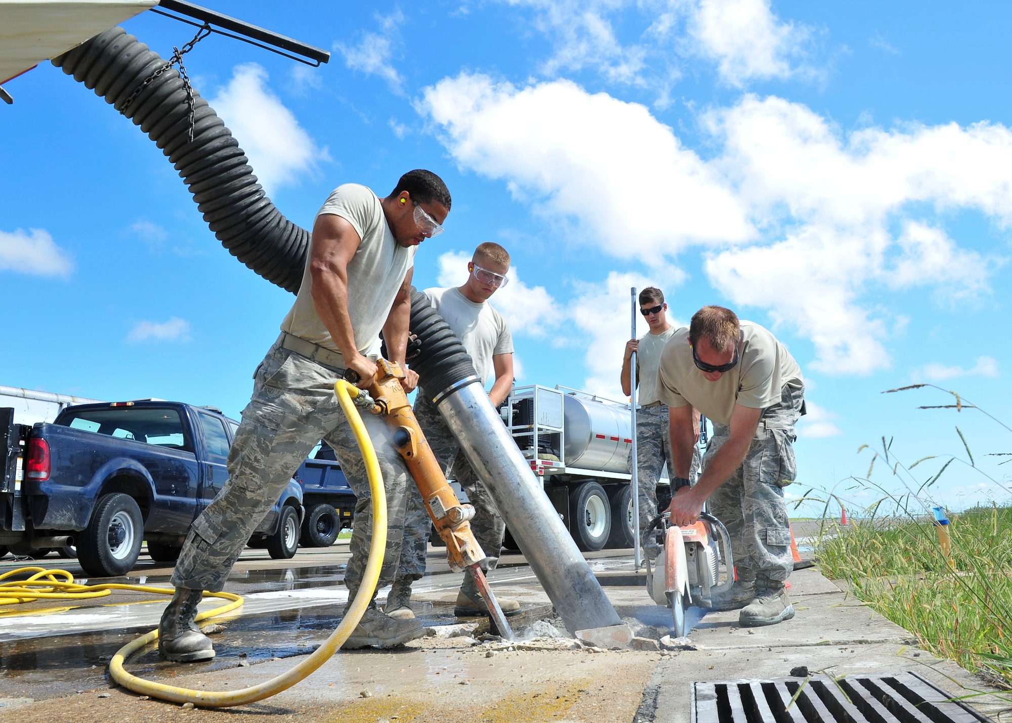 U.S. Air Force 633rd Civil Engineer Squadron pavements and equipment Airmen, repair sections of the runway at Langley Air Force Base, Va., Aug. 27, 2014.  According to 633rd CES leadership the improvements will provide a safe environment to sustain current flying operations, and secure future mission capability.  (U.S. Air Force photo by Senior Airman Connor Estes/Released)