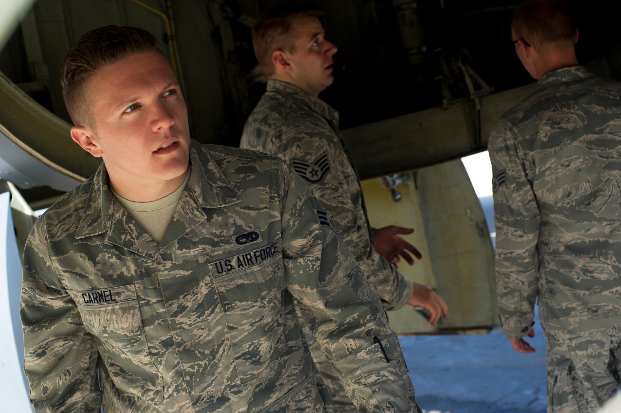 Senior Airman Kevin Carmel, 5th Aircraft Maintenance Squadron crew chief, performs a pre-flight inspection on a B-52H Stratofortress on Minot Air Force Base, N.D., Aug. 28, 2014. Carmel is part of the crew chief team that will represent Minot AFB in the Global Strike Challenge. The team will be evaluated on how they perform their pre-flight inspections and knowledge of their job. (U.S. Air Force photo/Senior Airman Brittany Y. Bateman) 