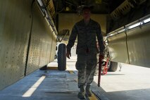 Senior Airman Kevin Carmel, 5th Aircraft Maintenance Squadron crew chief, performs a pre-flight inspection on a B-52H Stratofortress on Minot Air Force Base, N.D., Aug. 28, 2014. Carmel is part of the crew chief team that will represent Minot AFB in the Global Strike Challenge. The team will be evaluated on how they perform their pre-flight inspections and knowledge of their job. (U.S. Air Force photo/Senior Airman Brittany Y. Bateman) 