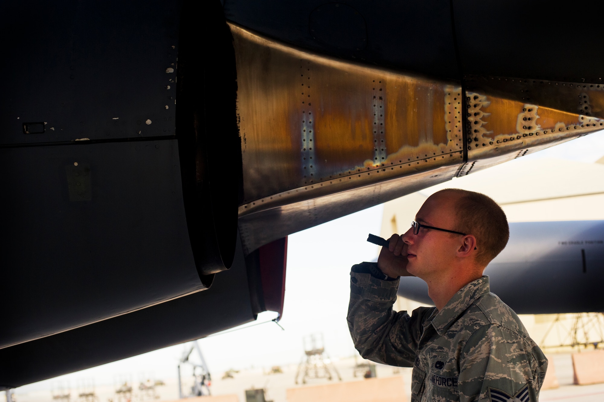 Senior Airman Quentin Haynes, 5th Aircraft Maintenance Squadron crew chief, performs a preflight inspection on a B-52H Stratofortress on Minot Air Force Base, N.D., Aug. 28, 2014. Haynes is part of the crew chief team that will represent Minot AFB in the Global Strike Challenge. (U.S. Air Force photo/Senior Airman Brittany Y. Bateman) 