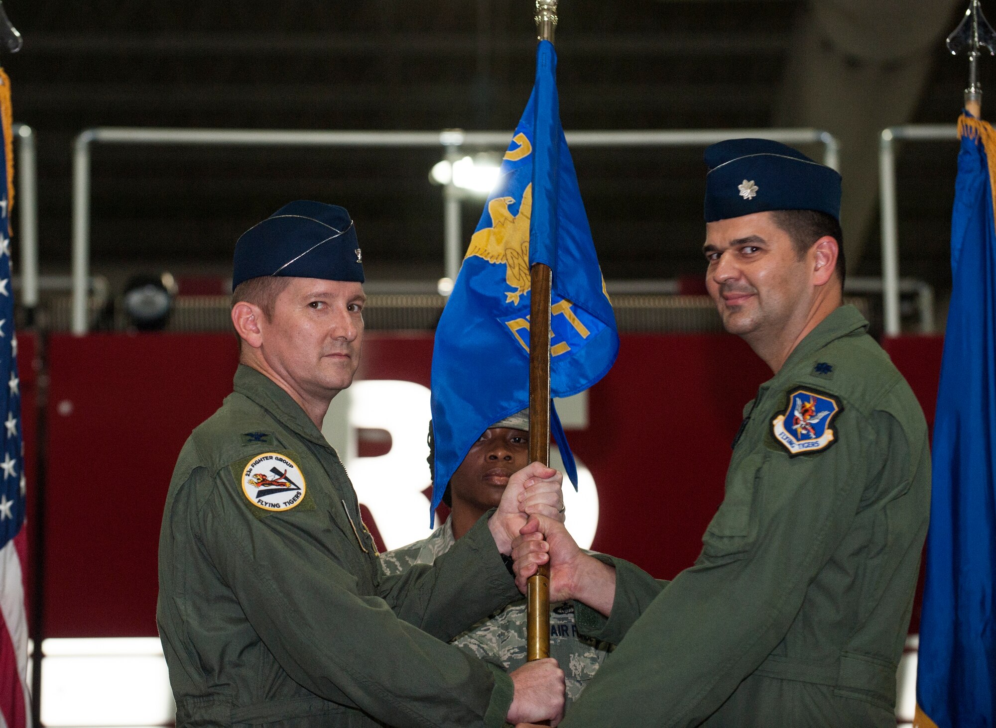 U.S. Air Force Col. Derek Oaks, 23d Fighter Group commander, passes the guidon to Lt. Col. Kevin Beeker, the new commander for Detachment 1, 23d Fighter Group, during an assumption of command ceremony at Avon Park Air Force Training Range, Fla., Aug. 28, 2014. Det. 1 was recently reassigned to the 23d FG from the 23d Wing. (U.S. Air Force photo by Senior Airman Jarrod Grammel/Released)

