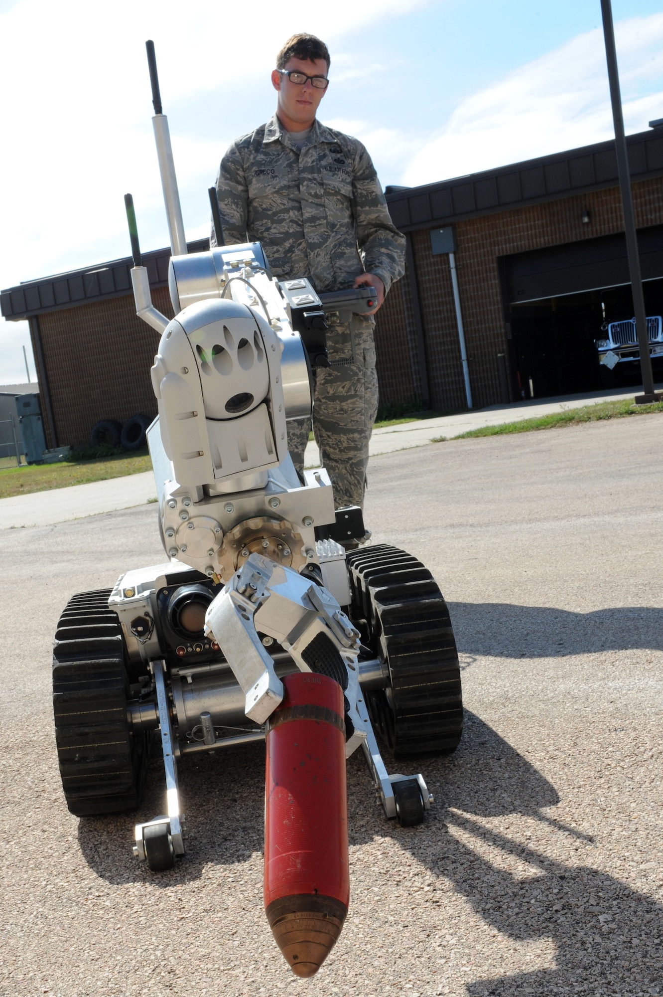 Staff Sgt. Scott Greco, 28th Civil Engineer Squadron Explosive Ordinance Disposal team chief, operates a bomb disposal robot at Ellsworth Air Force Base, S.D., Aug. 27, 2014. In addition to supporting the 28th Bomb Wing, EOD serves on call for a 200 mile radius around Ellsworth, to include Wyoming, Nebraska and Montana. (U.S. Air Force photo by Senior Airman Hailey R. Staker) 
