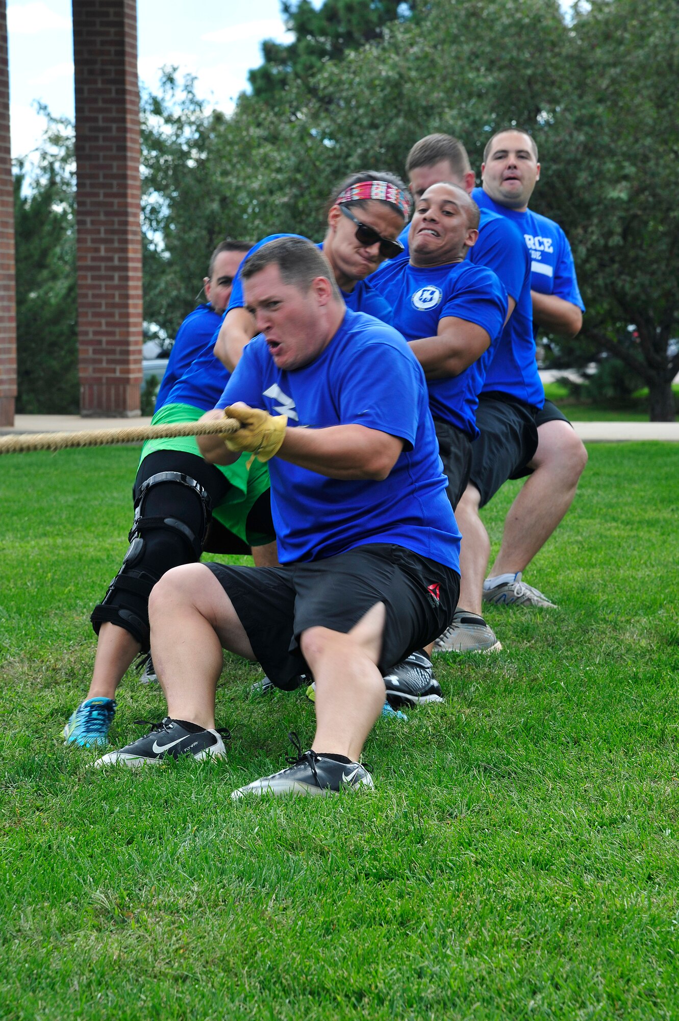 PETERSON AIR FORCE BASE, Colo. -- Airmen from Schriever Air Force Base give their all in a tug-of-war match during the first-ever Tri-Wing Sports Challenge Aug. 27 hosted by Peterson Air Force Base. The Tri-Wing Sports Challenge was an opportunity for Airmen from Buckley AFB, Peterson AFB and Schriever AFB to strengthen the bonds of camaraderie in an environment outside of the workplace. (U.S. Air Force Photo/Robb Lingley)