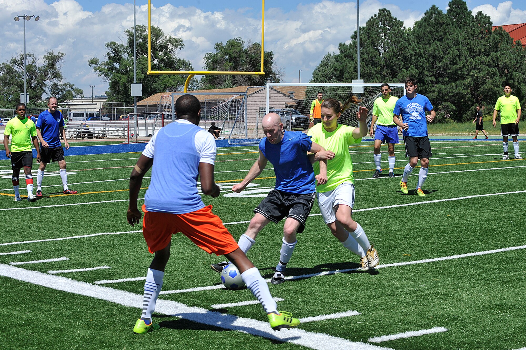 PETERSON AIR FORCE BASE, Colo. -- Peterson Air Force Base and Schriever Air Force Base compete in soccer during the first-ever Tri-Wing Sports Challenge 27 Aug. hosted by Peterson Air Force Base. The Tri-Wing Sports Challenge was an opportunity for Airmen from Buckley AFB, Peterson AFB and Schriever AFB to strengthen the bonds of camaraderie in an environment outside of the workplace. (U.S. Air Force Photo/Dennis Howk)