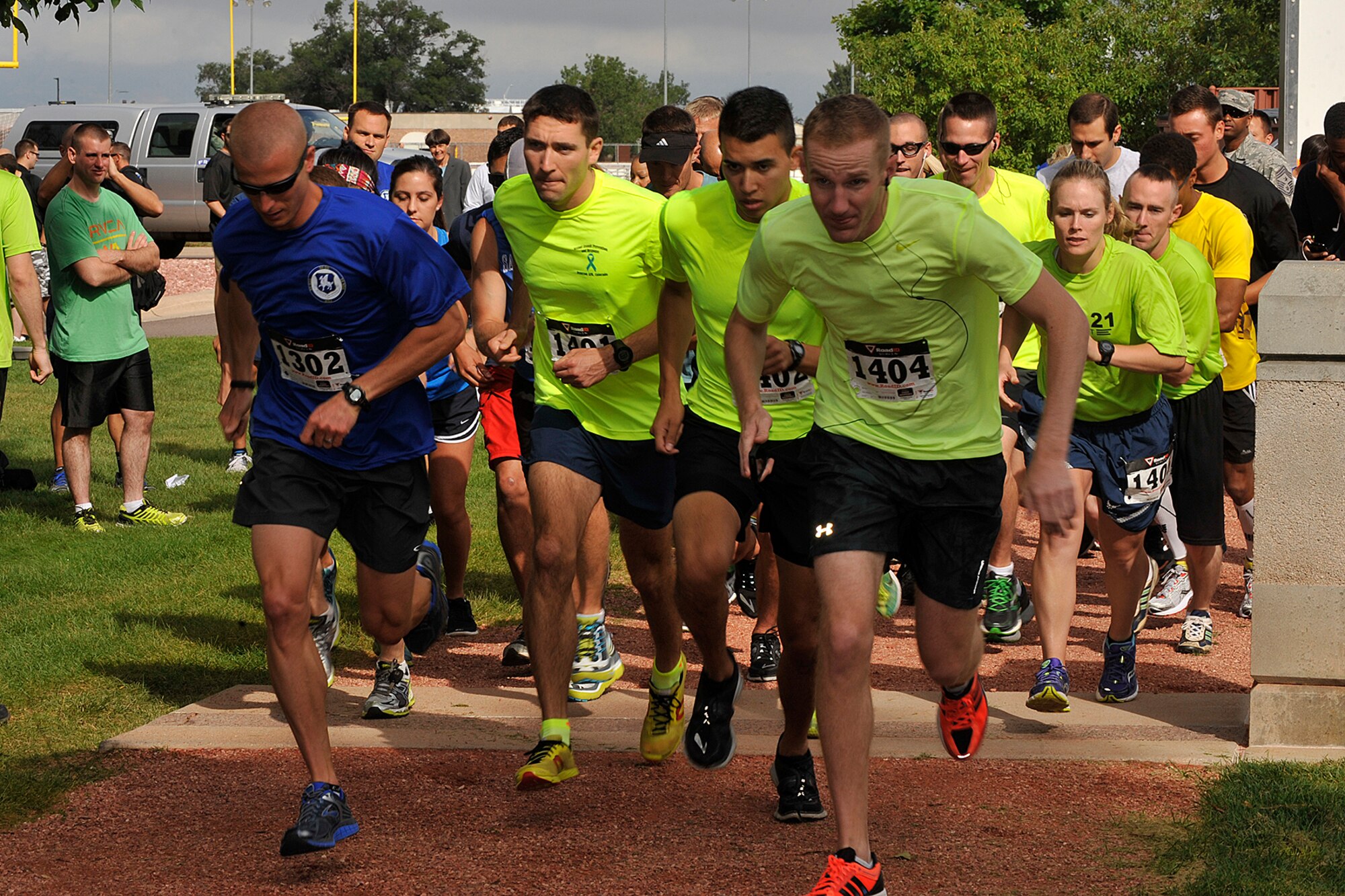 PETERSON AIR FORCE BASE, Colo. -- The 5K run begins at Peterson Air Force Base at the first-ever Tri-Wing Sports Challenge between Peterson Air Force Base, Schriever Air Force Base and Buckley Air Force Base, Aug 27. The Tri-Wing Sports Challenge was an opportunity for Airmen from Buckley AFB, Peterson AFB and Schriever AFB to strengthen the bonds of camaraderie in an environment outside of the workplace. (U.S. Air Force Photo/Dennis Howk)