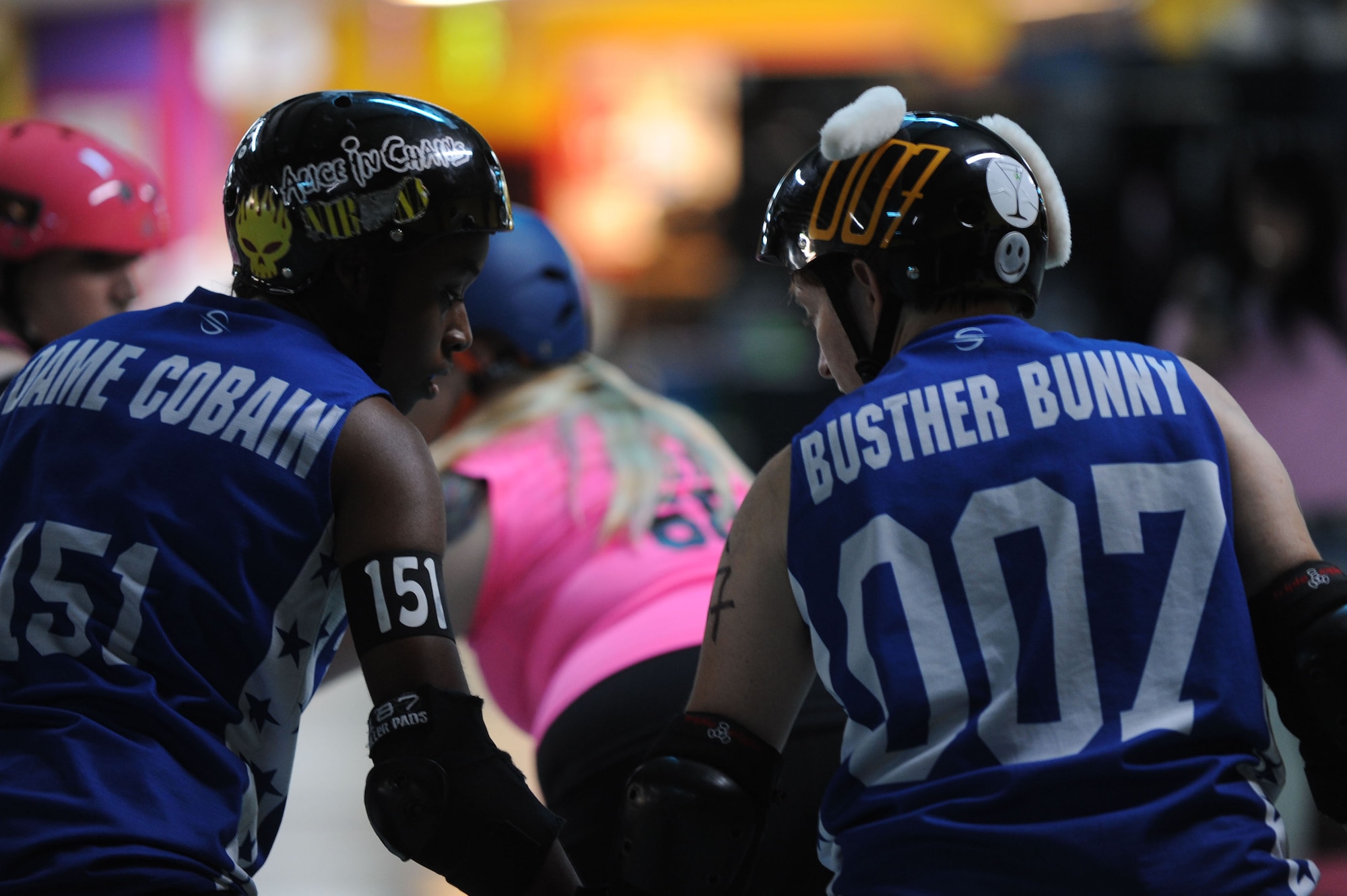 Lt. Col. Melanie Friedman, Curtis E. Lemay Center for Doctrine Development and Education deputy director of intelligence, goes over blocking strategy with teammate Dame Cobain at the Capitol City Rollin’ Rebels and Mobile Derby Darlins’ roller derby bout Aug. 9, 2014. Friedman is the oldest player on the Capitol City Rollin’ Rebels giving younger members of her team different perspectives on bout play. (U.S. Air Force photo by Staff Sgt. Natasha Stannard)