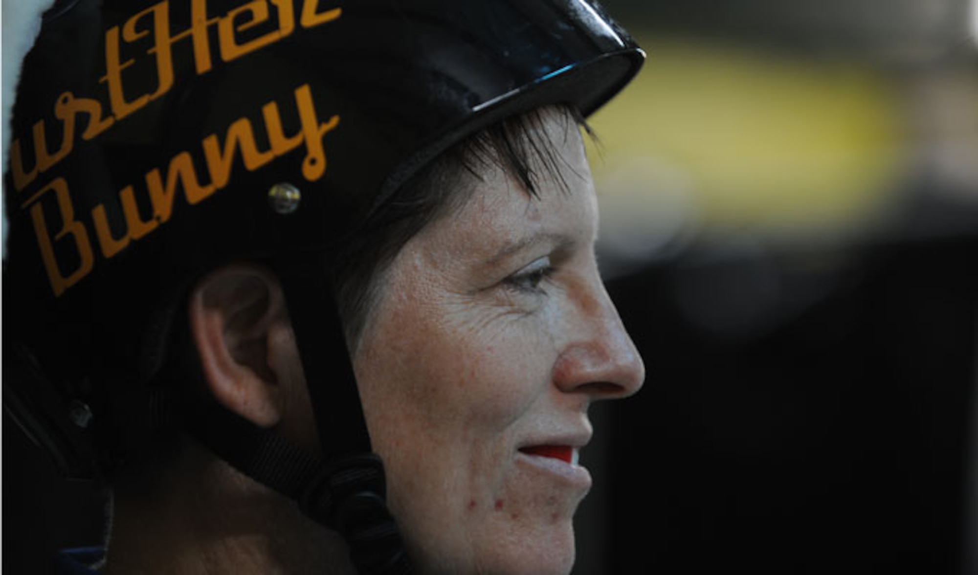 Lt. Col. Melanie Friedman looks at the skating rink moments before the Capitol City Rollin’ Rebels and Mobile Derby Darlins’ roller derby  bout Aug. 9, 2014. Friedman is the deputy director of intelligence at the Curtis E. Lemay Center for Doctrine, Development and Education at Maxwell Air Force Base. (U.S. Air Force photo by Staff Sgt. Natasha Stannard)