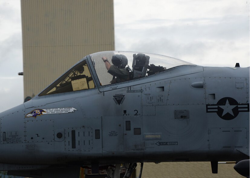 A pilot from the 104th Fighter Squadron, Warfield Air National Guard Base, Baltimore, Md. gestures his excitement while taxiing an A-10C during Exercise Red Flag - Alaska 14-3, Eielson Air Force Base, Ak. Exercise Red Flag is a 10 day exercise that is a series of Pacific Air Forces commander-directed field training exercises for U.S. forces, provides joint offensive counter-air, interdiction, close air support, and large force employment training in a simulated combat environment. (Air National Guard photo by Tech. Sgt. Christopher Schepers/RELEASED)