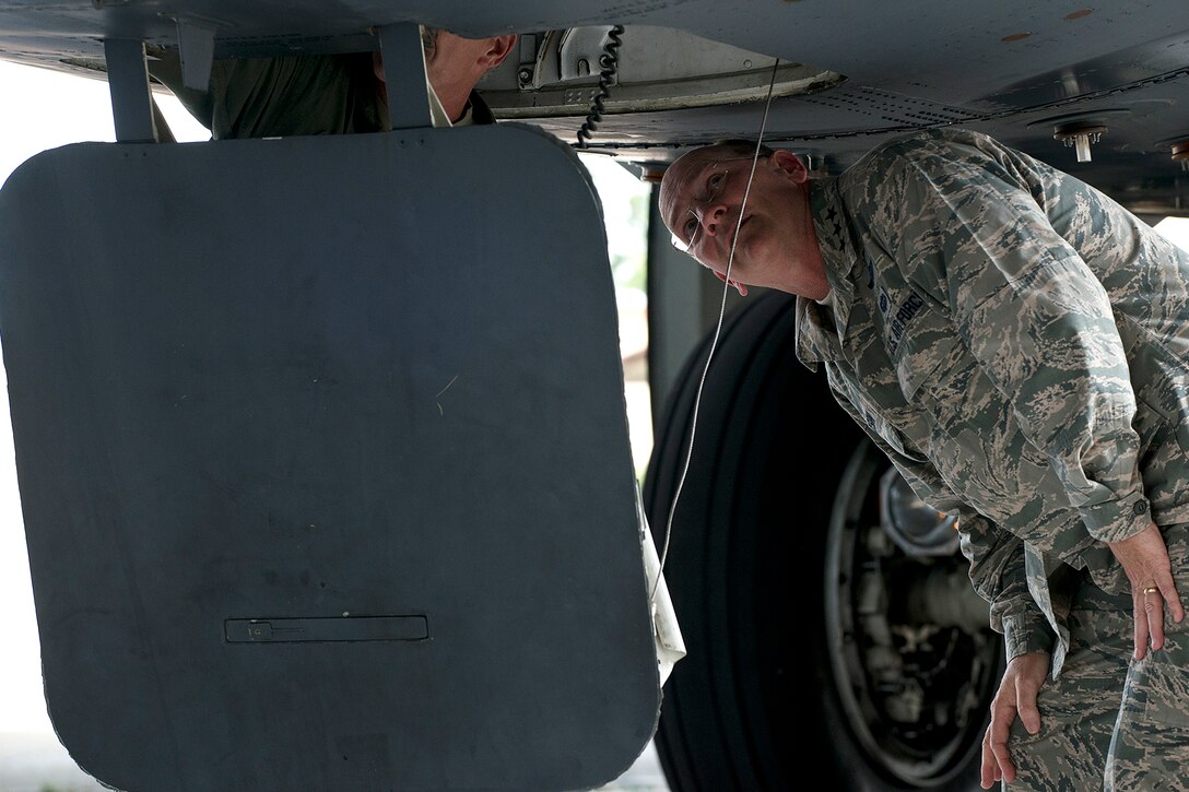 U.S. Air Force Lt. Gen. James Jackson, Commander of Air Force Reserve Command, looks up the hatch into the cockpit of a 307th Bomb Wing (BW) B-52H Stratofortress during a tour on Aug. 26, 2014, Barksdale Air Force Base, La. Jackson's visit to Barksdale included a tour of the 307th BW and then attending the Air Reserve Component Focus Day, which was hosted by the Air Force Global Strike Command. (U.S. Air Force photo by Master Sgt. Greg Steele/Released)