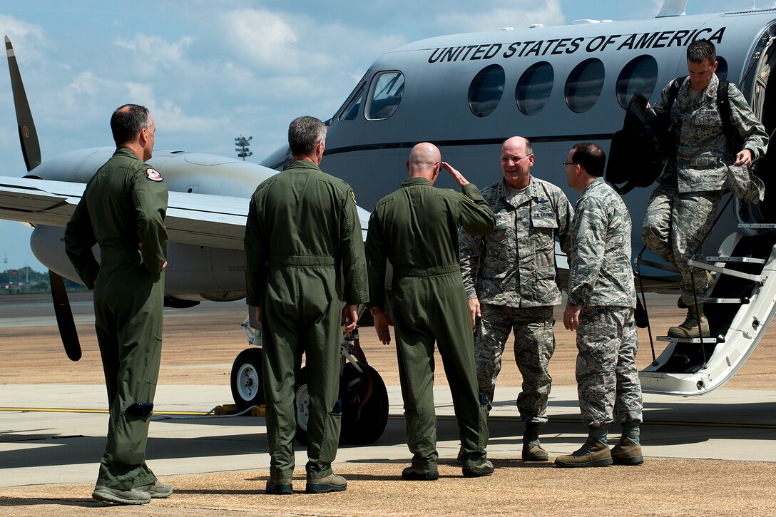 U.S. Air Force Lt. Gen. James Jackson, Commander of the Air Force Reserve Command, is greeted by U.S. Air Force Col. Jonathan Ellis, 307th Bomb Wing (BW) commander, after arriving at Barksdale Air Force Base, La., Aug. 26, 2014. Jackson's visit to Barksdale included a tour of the 307th BW and then attending the Air Reserve Component Focus Day, which was hosted by the Air Force Global Strike Command. (U.S. Air Force photo by Master Sgt. Greg Steele/Released)