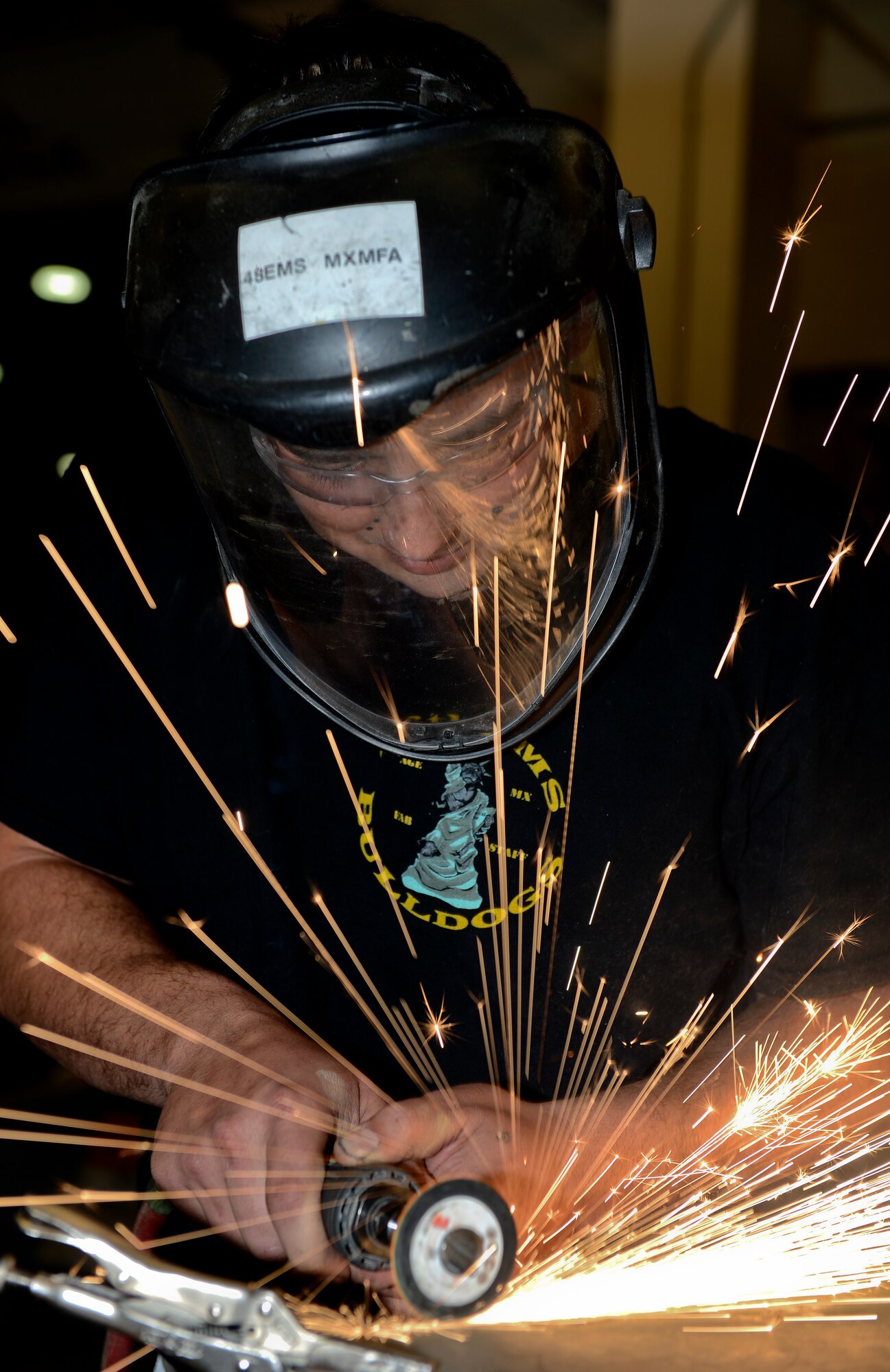Staff Sgt. Christopher Greene, 48th Equipment Maintenance Squadron aircraft structural maintenance supervisor, cuts sheet metal at Royal Air Force Lakenheath, England, Aug. 29, 2014. Greene was nominated for this week’s RAF Lakenheath Liberty Spotlight because he displays the core value of Service Before Self. (U.S. Air Force photo by Airman 1st Class Trevor T. McBride/Released)