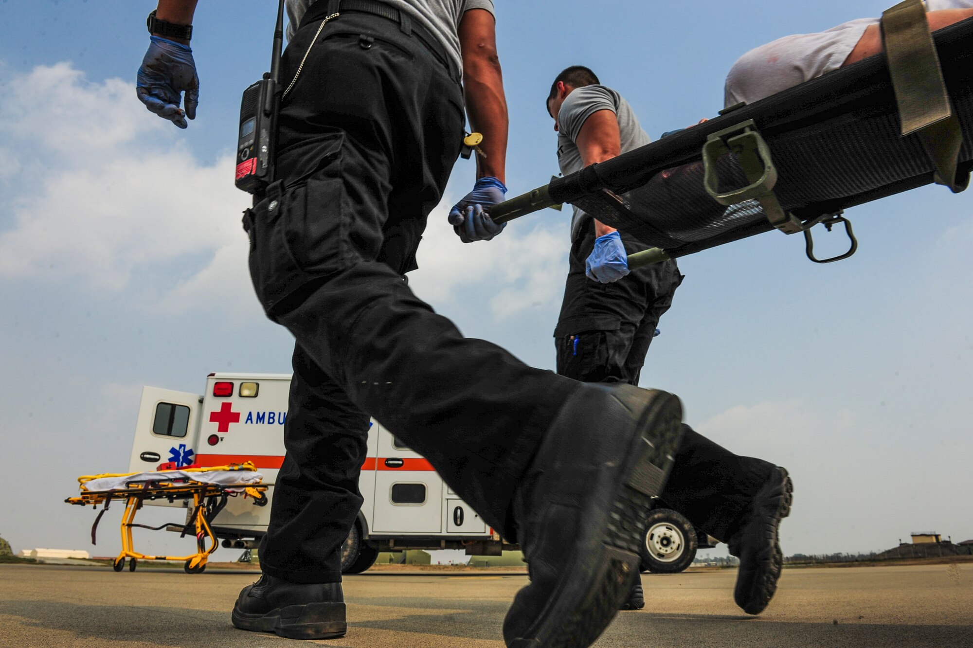 First responders from the 39th Medical Group carry a patient onto an ambulance during a local readiness exercise Aug. 28, 2014, Incirlik Air Base, Turkey.  First responders from the 39th Air Base Wing attend readiness training which keeps skills sharp for real world emergencies. (U.S. Air Force photo by Senior Airman Nicole Sikorski/Released)