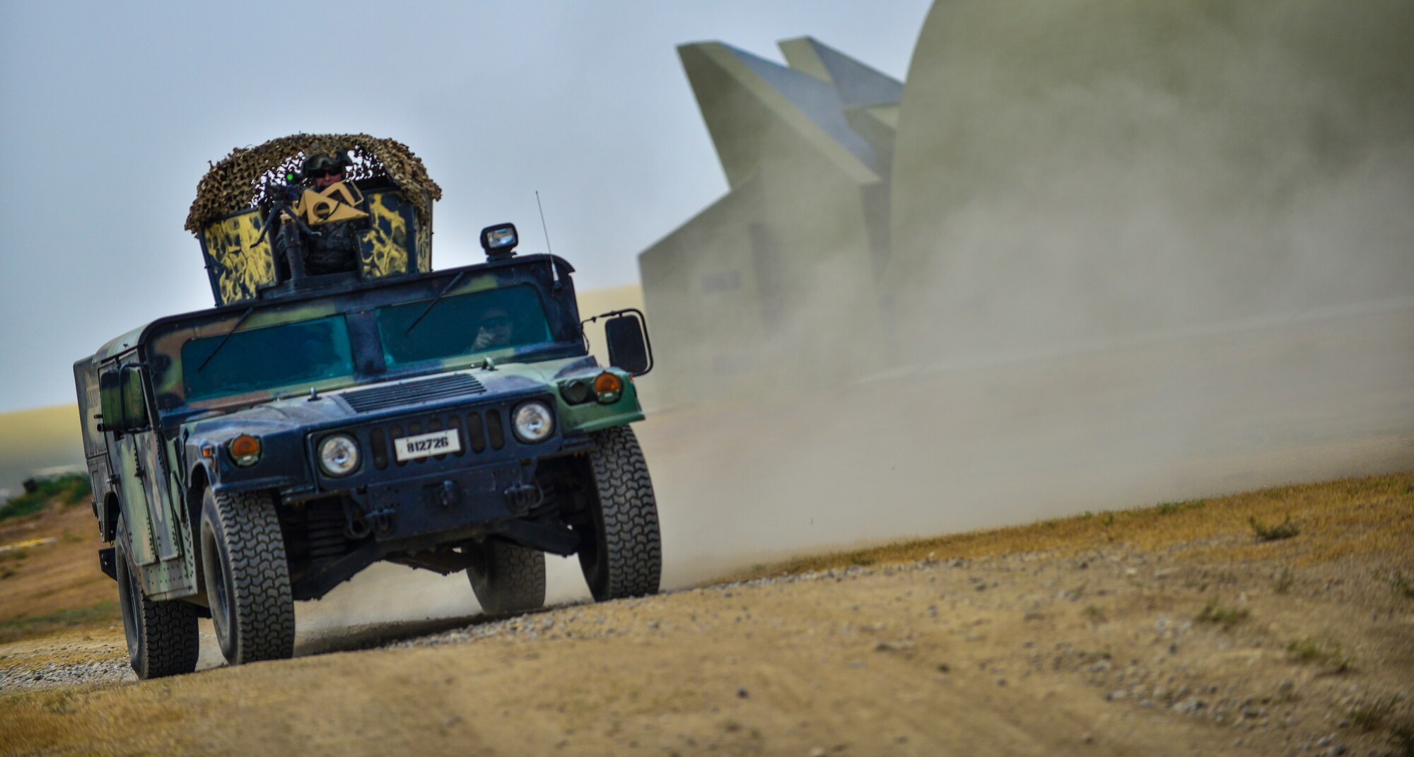 Airmen assigned to the 39th Security Forces Squadron drive in a Humvee during a local readiness exercise Aug. 28, 2014, Incirlik Air Base Turkey.  Responders including security forces, fire and medical Airmen often simulate for emergency situations to keep skills and procedures up to standard. (U.S. Air Force photo by Senior Airman Nicole Sikorski/Released)