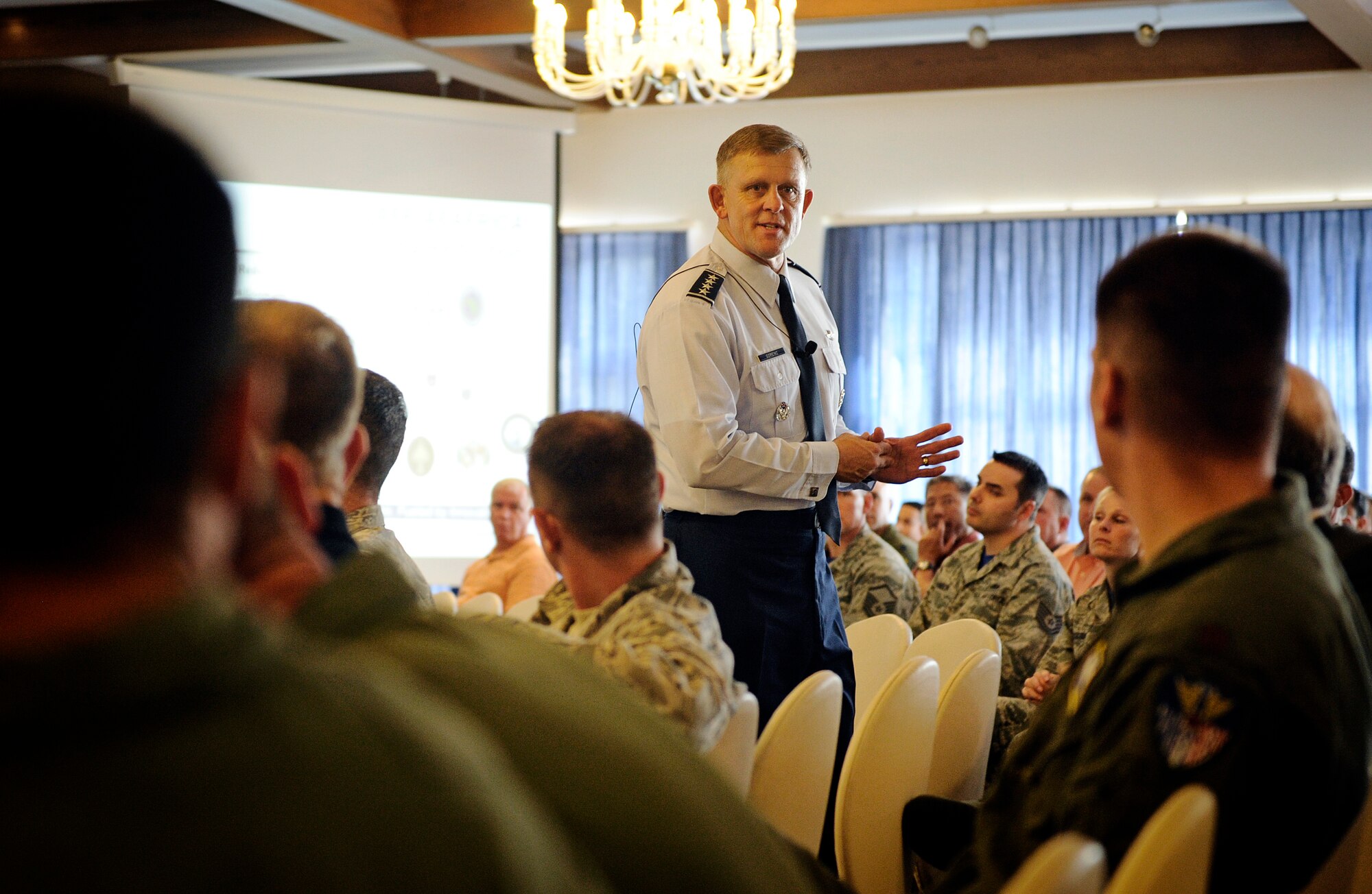 Gen. Frank Gorenc, U.S. Air Forces in Europe and Air Forces Africa commander, speaks to the headquarters staff during a commanders call Aug. 29, 2014. Gorenc discussed topics such as headquarters reductions, Summer safety and the new "RUfit" campaign designed to help build resilient Airmen. (U.S. Air Force photo/ Staff Sgt. Ryan Crane)