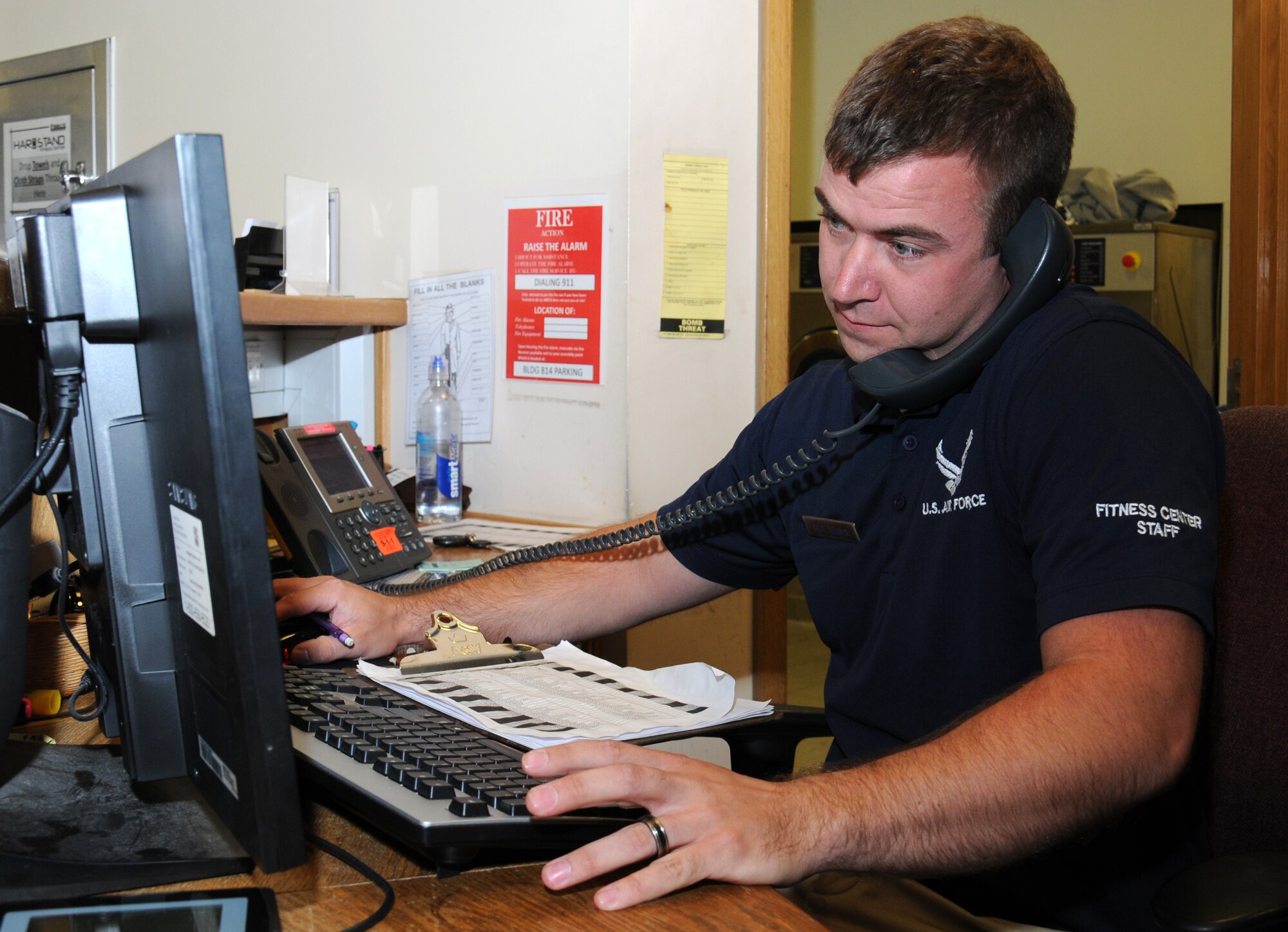 U.S. Air Force Senior Airman Corey Adams, 100th Force Support Squadron Sports director of the Hardstand Fitness Center from New Lothrop, Mich., organizes a sports event Aug. 20, 2014, on RAF Mildenhall, England. The fitness center offers many team sports including outdoor soccer, flag football, volleyball, basketball and softball. (U.S. Air Force photo/Gina Randall/Released)