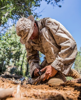 U.S. Marine Pfc. Jose Gutierrez makes a bow drill fire starter during Mountain Exercise 2014 aboard Marine Corps Mountain Warfare Training Center in Bridgeport, Calif., Aug. 28, 2014. Gutierrez is an infantry rifleman assigned to 2nd Platoon, India Company, 3rd Battalion, 1st Marine Regiment. Marines with 3rd Battalion, 1st Marine Regiment will become the 15th Marine Expeditionary Unit’s ground combat element in October. Mountain Exercise 2014 develops critical skills the battalion will need during deployment. (U.S. Marine Corps photo by Sgt. Emmanuel Ramos/Released)