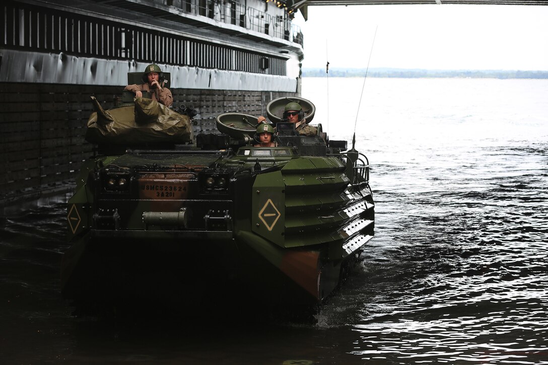 Amphibious assault vehicles with the 11th Marine Expeditionary Unit return to the USS Comstock with members of the Malaysian Armed Forces during Malaysia-U.S. Amphibious Exercise Aug. 28. MALUS AMPHEX 14 is a bilateral exercise between the 11th MEU and Malaysian Armed Forces that includes operational and tactical level training in planning, command and control, and combat service support using both ground and sea assets. (U.S. Marine Corps photo by Sgt. Melissa Wenger/Released) 