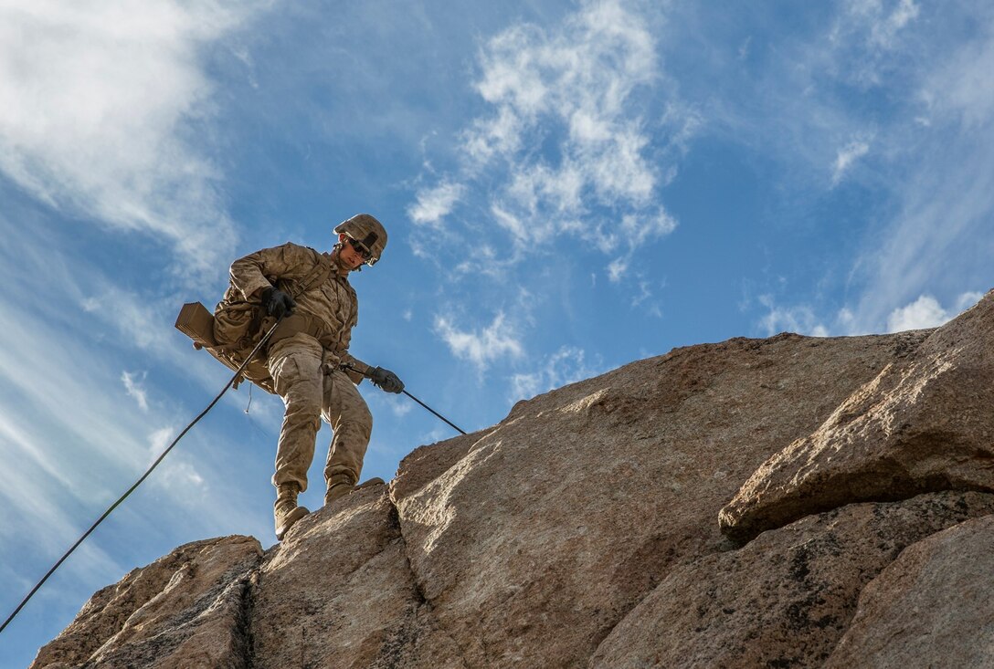 Cpl. Matthew Long rappels down a cliff during Mountain Exercise 2014 aboard Marine Corps Mountain Warfare Training Center in Bridgeport, California, Aug. 29, 2014. Long is a squad leader with 3rd Platoon, Lima Company, 3rd Battalion, 1st Marine Regiment. Marines with 3rd Battalion, 1st Marine Regiment will become the 15th Marine Expeditionary Unit’s ground combat element. Mountain Exercise 2014 develops critical skills the battalion will need during deployment.