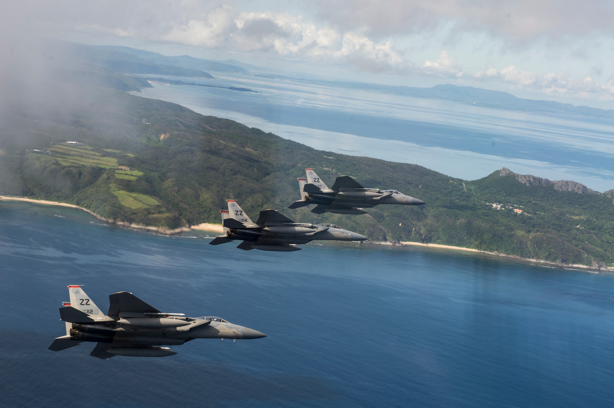 U.S. Air Force F-15 Eagles from the 67th Fighter Squadron fly a training mission over the Pacific Ocean outside of Kadena Air Base, Japan, Aug. 25, 2014. The 67th FS has been a part of Kadena's team since March 15, 1971, and provides air defense and air superiority in the Asian-Western Pacific area of operations. (U.S. Air Force photo by Staff Sgt. Stephany Richards/Released)