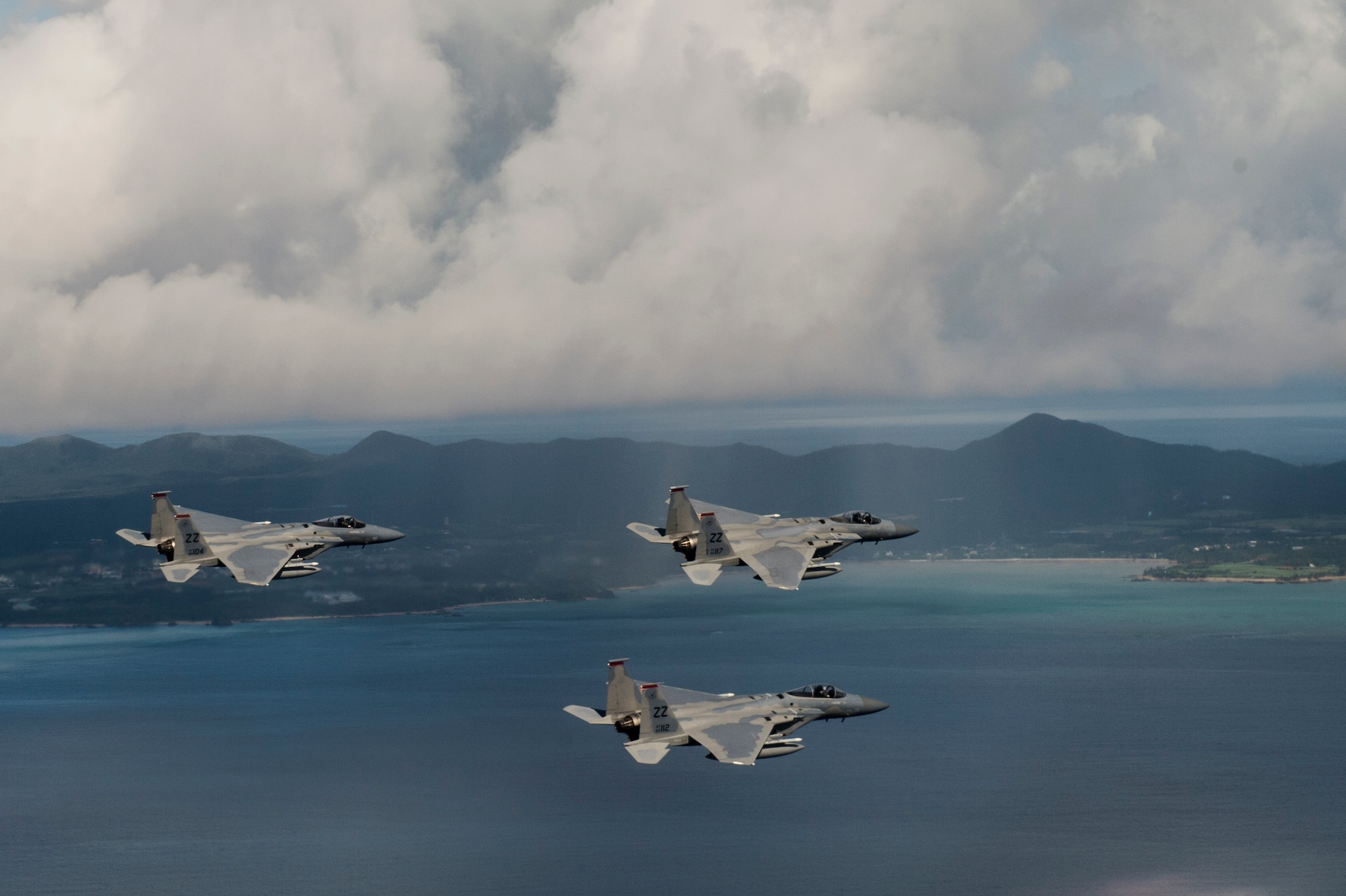 U.S. Air Force F-15 Eagles from the 67th Fighter Squadron fly a training mission over the Pacific Ocean outside of Kadena Air Base, Japan, Aug. 25, 2014. The 67th FS has been a part of Kadena's team since March 15, 1971, and provides air defense and air superiority in the Asian-Western Pacific area of operations. (U.S. Air Force photo by Staff Sgt. Stephany Richards/Released)