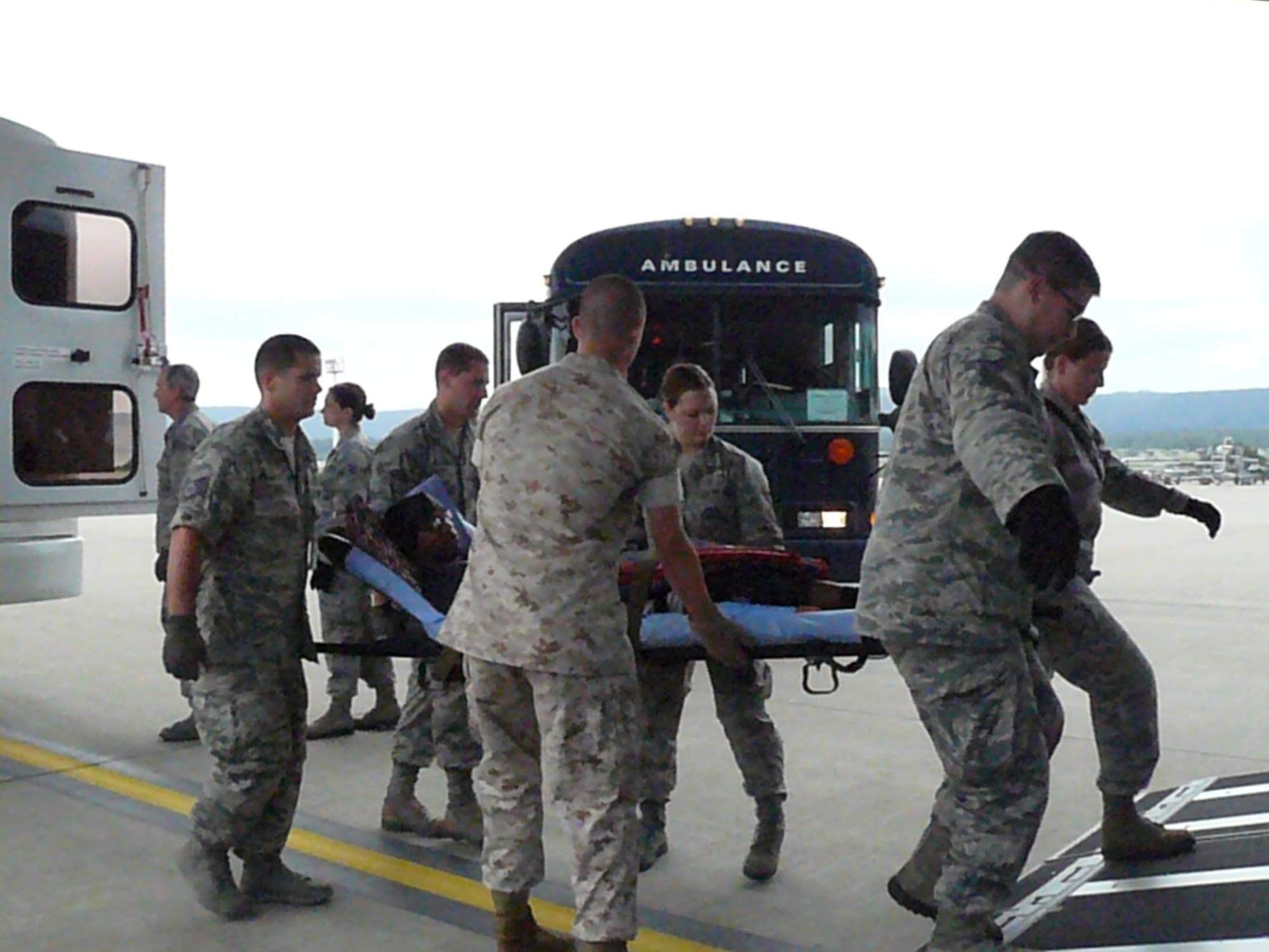 A Contingency Aeromedical Staging Facility team including six members from the 944th ASTS, Luke Air Force Base, help transport injured military members as they travel from deployed locations to their care facilities in the United States. (U.S. Air Force photo/Maj. Elizabeth Magnusson)