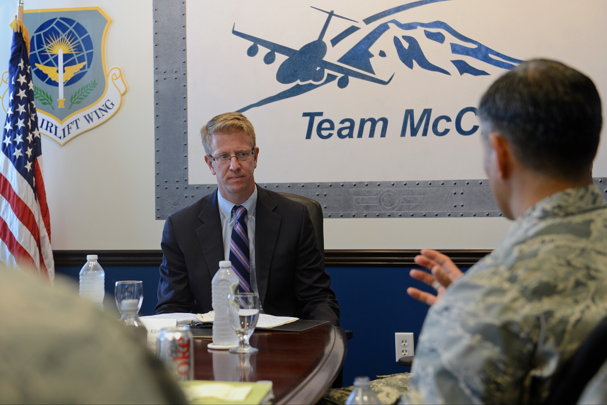 Col. David Kumashiro, 62nd Airlift Wing commander, talks to Congressman Derek Kilmer about joint basing Sept. 2, 2014, during a tour at Joint Base Lewis-McChord, Wash. Kilmer visited the base to gain a better understanding of joint basing’s overall mission and the impacts of total force reduction. (U.S. Air Force photo/Airman 1st Class Jacob Jimenez) 