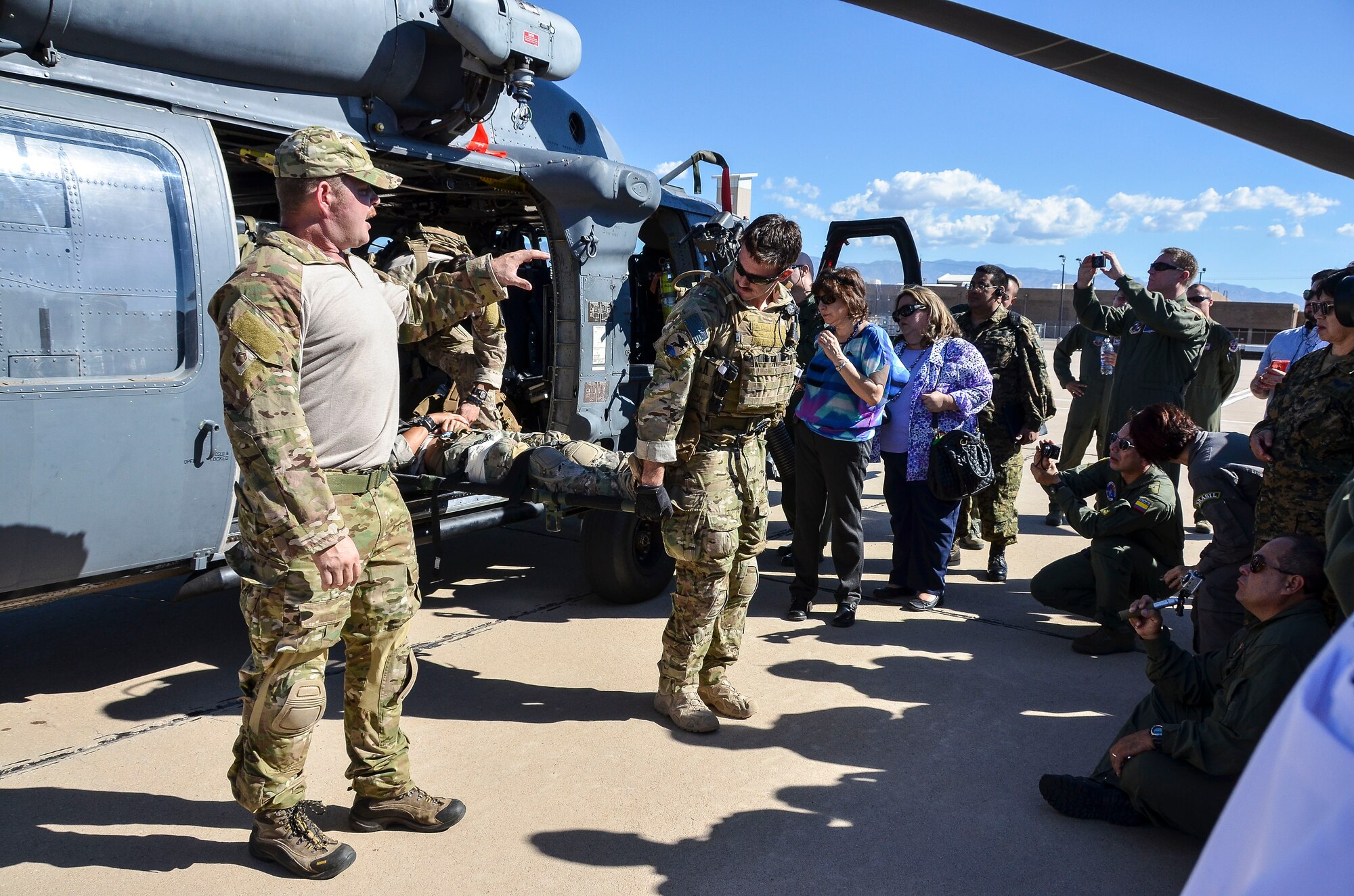 Pararescuemen from the 48th Rescue Squadron at Davis-Monthan Air Force Base, Ariz., demonstrate casualty care to dozens of military medical professionals from Latin American nations Aug. 28, 2014. Air Forces Southern hosted the Aerospace Medicine Symposium as a multinational key leader engagement designed to strengthen aerospace medicine departments in priority Central American countries by leveraging the knowledge and leadership of South American partner nations with the U.S. Air Force serving as a facilitator. This event builds upon previous engagements with partner nation countries and allows a maturation of their aerospace medicine doctrine, policy, program and operational medicine capacity. The aerospace medicine professionals have prior experience or are currently responsible for proving direct care to pilots, aircrew, or with moving patients through an aeromedical platform. In attendance were representatives from our partner nations Costa Rica, Panama, Guatemala, El Salvador, Honduras, Colombia, Peru, Chile, Uruguay, and Brazil. (U.S. Air Force photo by Tech. Sgt. Heather R. Redman/Released)


