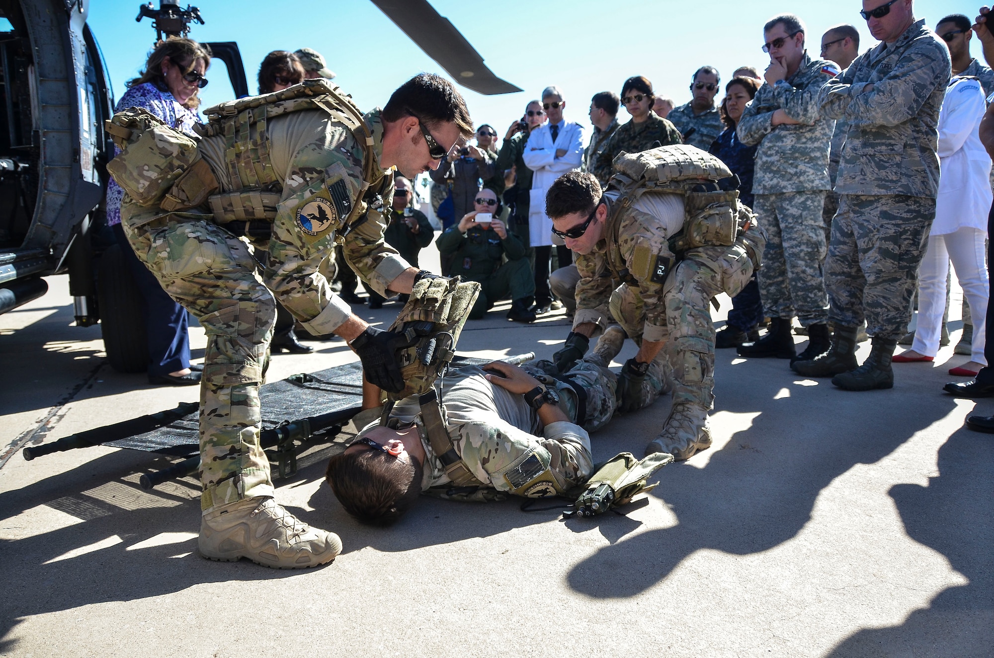 Pararescuemen from the 48th Rescue Squadron at Davis-Monthan Air Force Base, Ariz., demonstrate casualty care to dozens of military medical professionals from Latin American nations Aug. 28, 2014. Air Forces Southern hosted the Aerospace Medicine Symposium as a multinational key leader engagement designed to strengthen aerospace medicine departments in priority Central American countries by leveraging the knowledge and leadership of South American partner nations with the U.S. Air Force serving as a facilitator. This event builds upon previous engagements with partner nation countries and allows a maturation of their aerospace medicine doctrine, policy, program and operational medicine capacity. The aerospace medicine professionals have prior experience or are currently responsible for proving direct care to pilots, aircrew, or with moving patients through an aeromedical platform. In attendance were representatives from our partner nations Costa Rica, Panama, Guatemala, El Salvador, Honduras, Colombia, Peru, Chile, Uruguay, and Brazil. (U.S. Air Force photo by Tech. Sgt. Heather R. Redman/Released)


