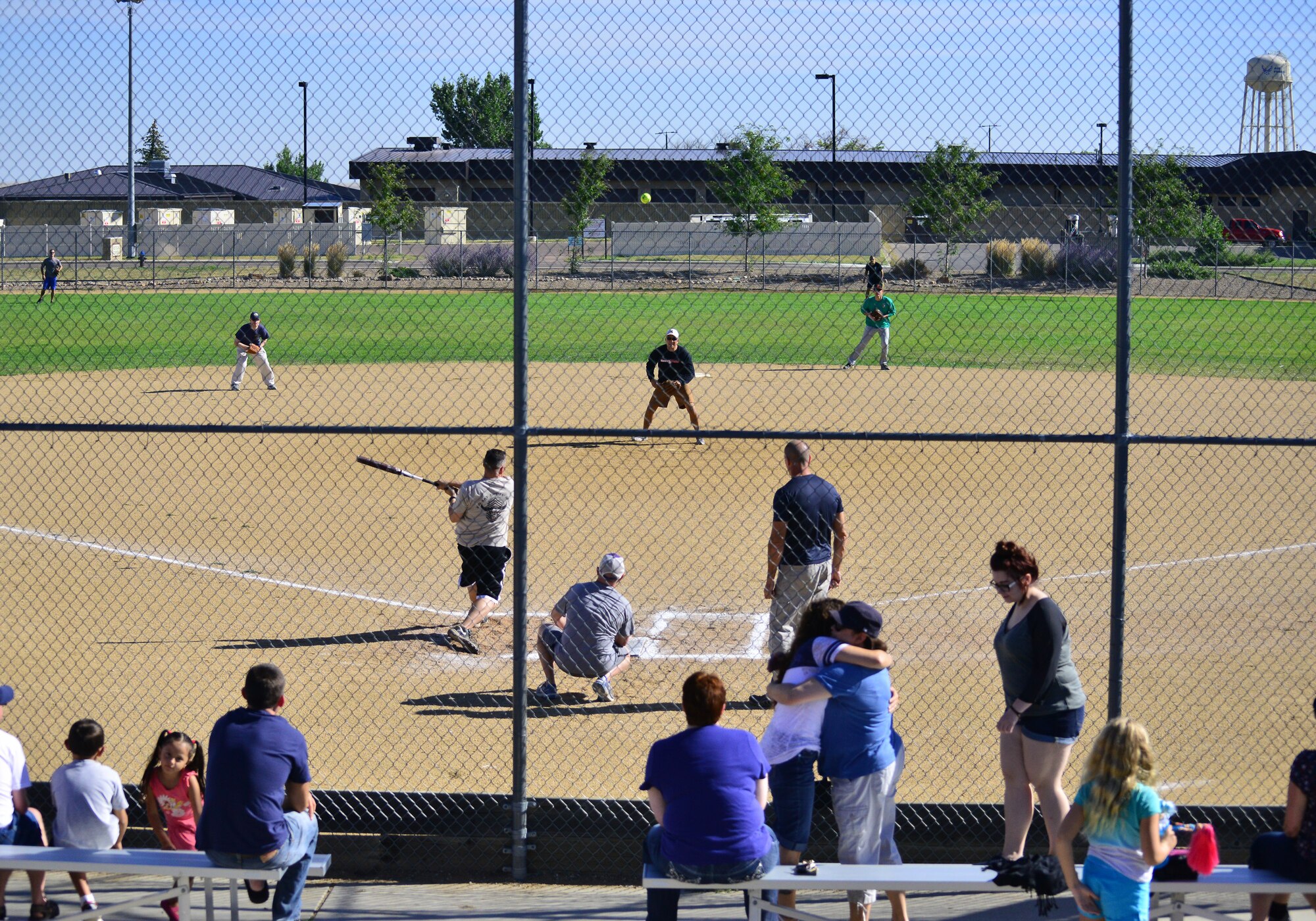 Malmstrom’s chiefs and colonels collide during the annual Chiefs versus Colonels’ softball game at the softball fields near the base auditorium Aug. 28. The chiefs won the game 11-9, and it signified the start of the base picnic. (U.S. Air Force photo/Tech. Sgt. Chad Thompson)