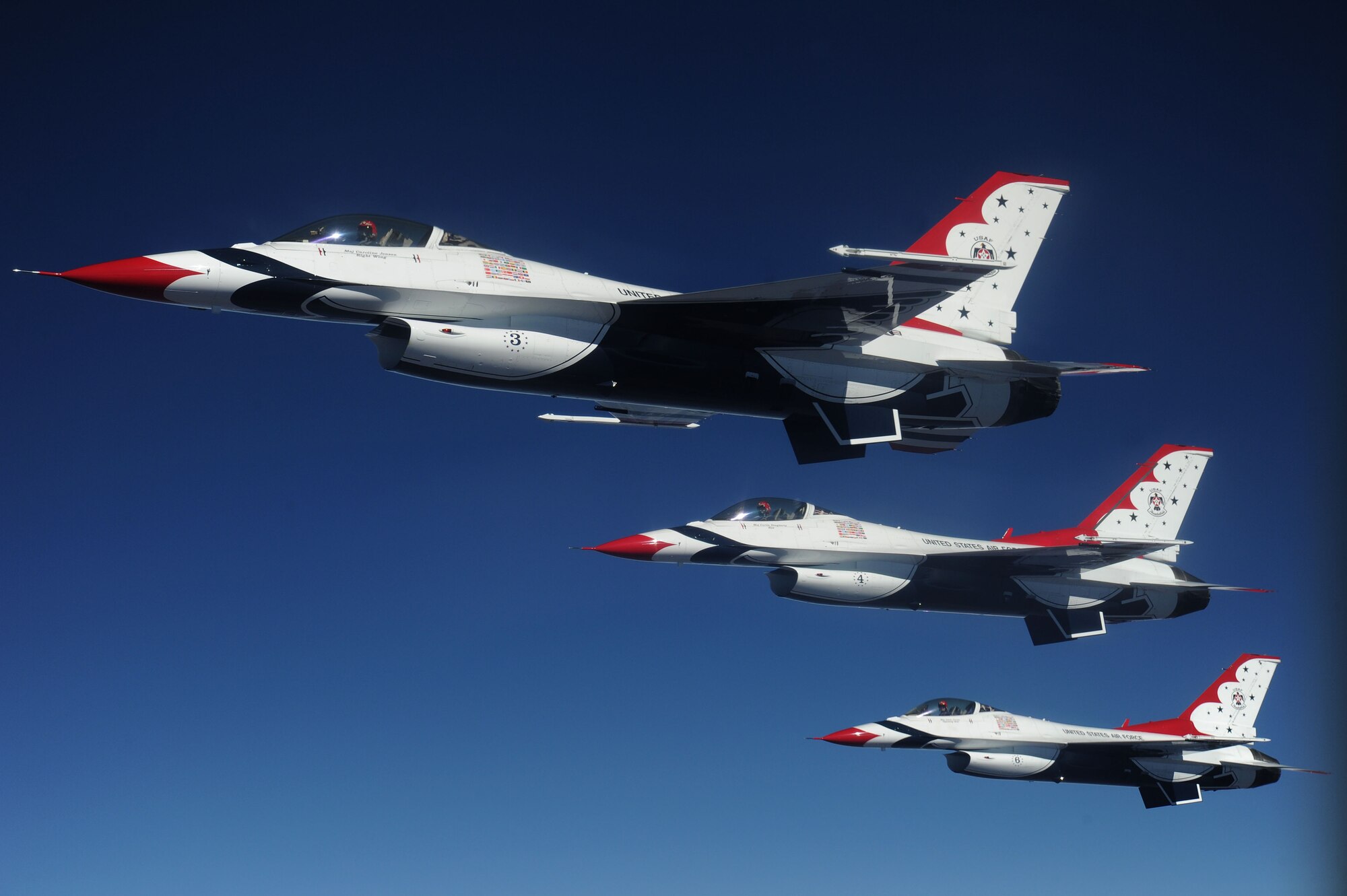 F-16 Fighting Falcons with the U.S. Air Force Aerial Demonstration Squadron Thunderbirds fly alongside a 92nd Air Refueling Wing KC-135 Stratotanker over Glacier National Park, Montana, Sept. 1, 2014. The Thunderbirds are about three-fourths of the way through their airshow season and have performed more than 30 shows so far. (U.S. Air Force photo by Airman 1st Class Janelle Patiño/Released)