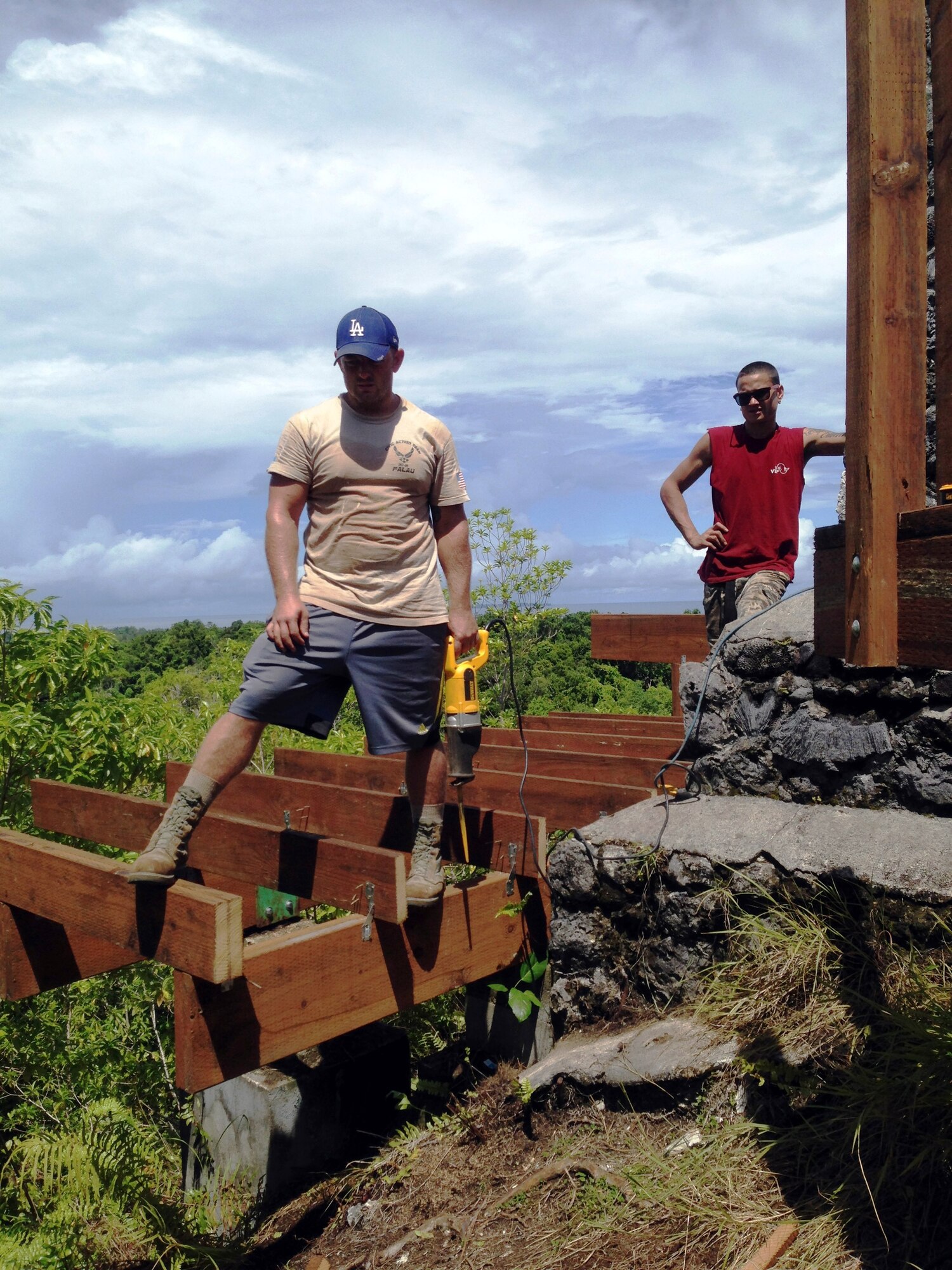 U.S. Air Force Tech. Sgt. Gerald Bontrager and apprentice Clynton look over the construction they’ve done on the lower deck around the Bloody Nose Ridge Memorial, Peleliu, Republic of Palau. The CAT-Palau team consisted of 13 Palauan apprentices who received certificates from both the CAT and the National Center for Construction Education and Research. (Courtesy photo/Released)