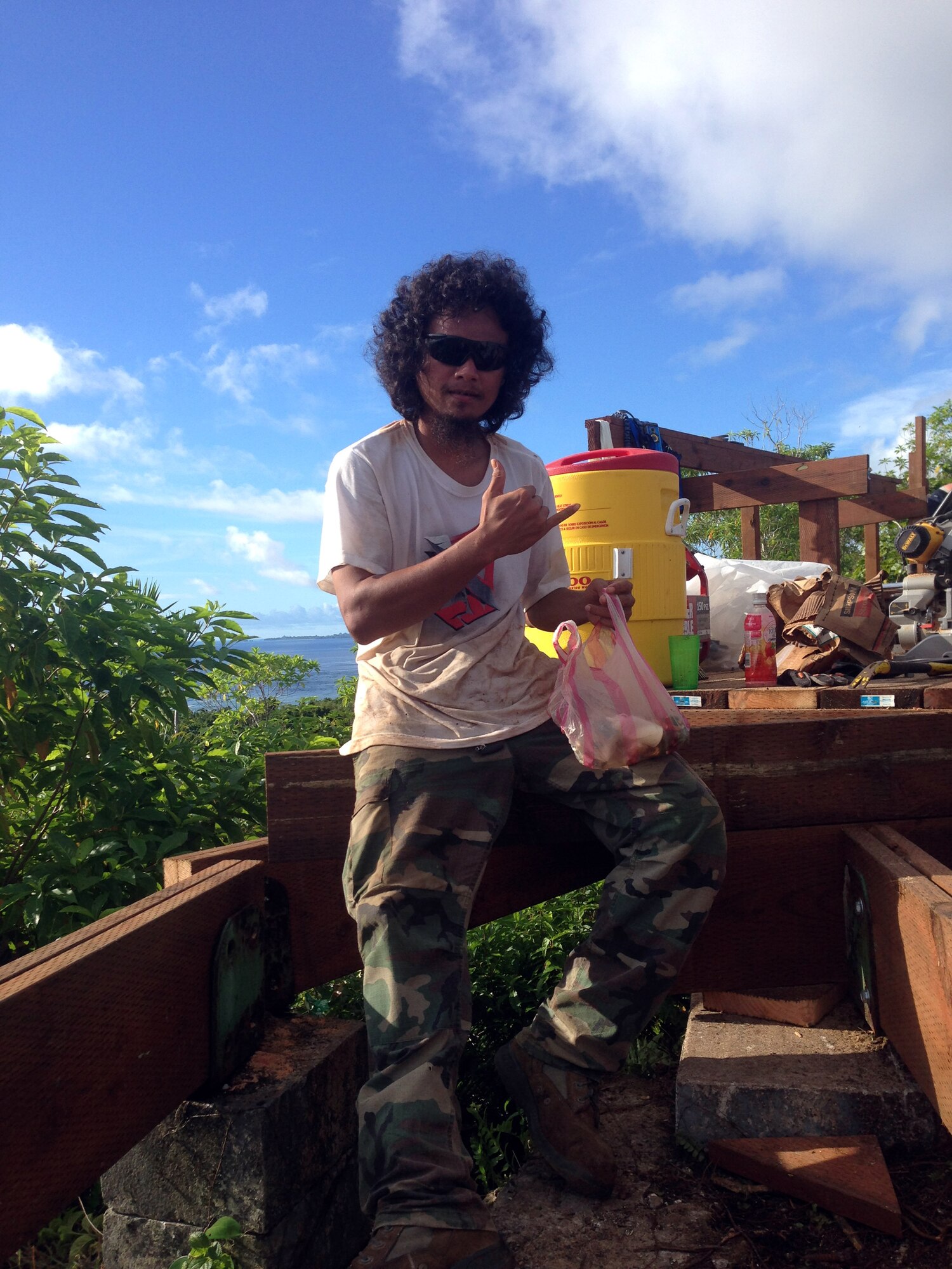 Apprentice TenTen takes a break from working on the deck project at the Bloody Nose Ridge Memorial, Peleliu, Republic of Palau. The CAT-Palau team consisted of 13 Palauan apprentices who received certificates from both the CAT and the National Center for Construction Education and Research. (Courtesy photo/Released)
