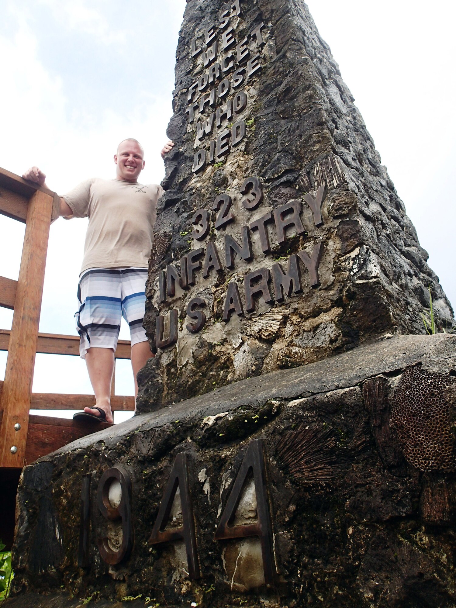 U.S. Air Force Master Sgt. Martin Grant stands next to the Bloody Nose Ridge Memorial, Peleliu, Republic of Palau. The CAT-Palau team consisted of 13 Airmen and 13 Palauan apprentices who worked over eight days to complete the project. (Courtesy photo/Released)