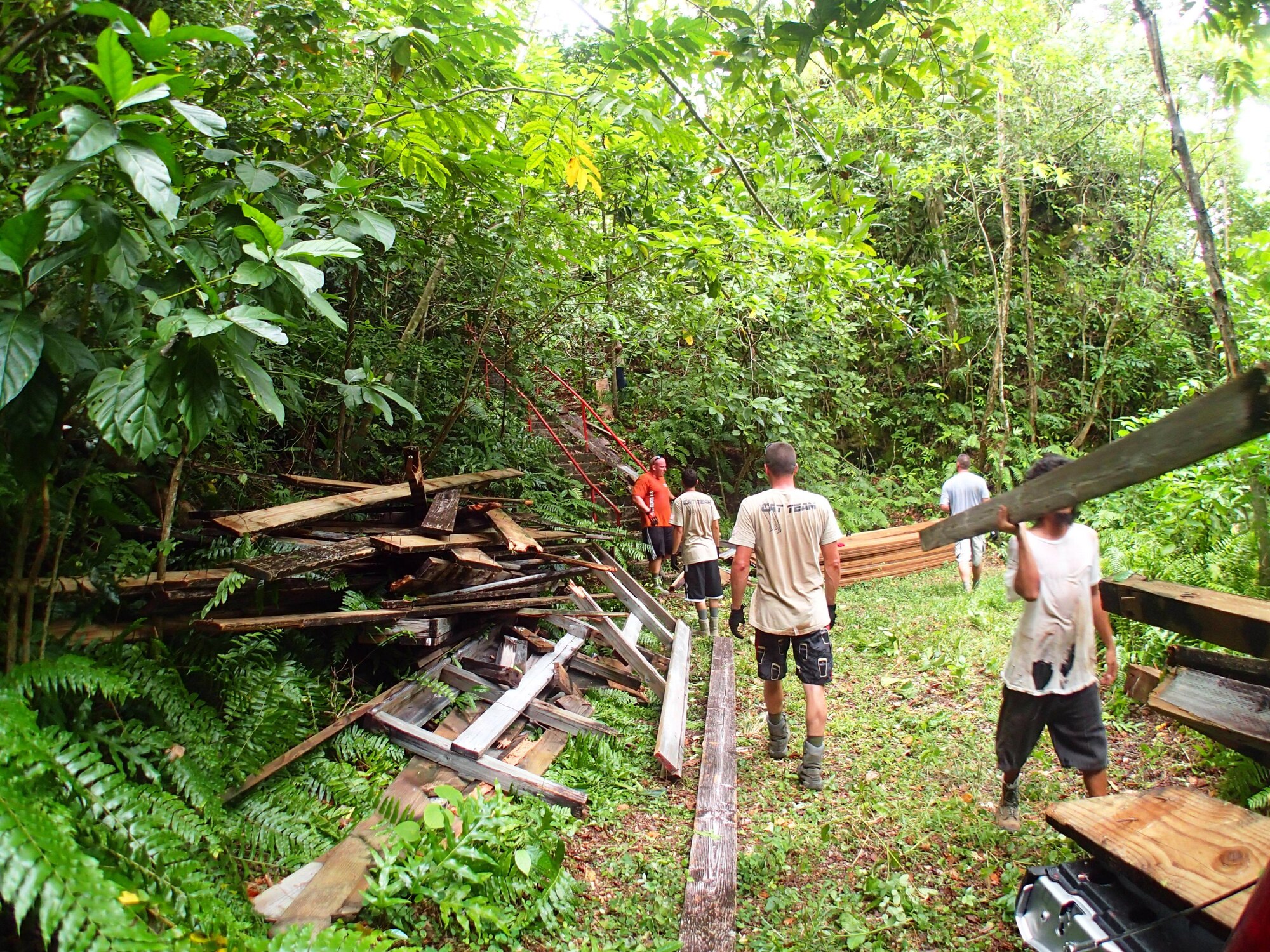 Civic Action Team-Palau takes the demolished deck to the bottom of the mountain, Peleliu, Republic of Palau. The older wood was donated to the local Palauans to be refurbished.  (Courtesy photo/Released)