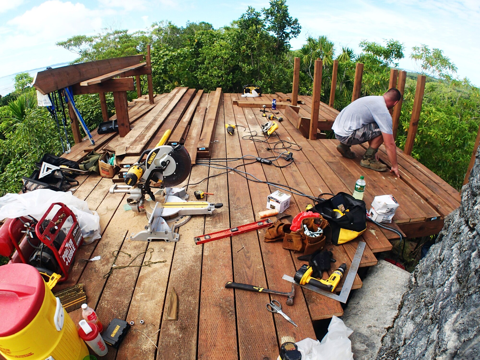 Civic Action Team-Palau constructs the new deck around the Bloody Nose Ridge Memorial, Peleliu, Republic of Palau. The CAT-Palau team consisted of 13 Airmen and 13 Palauan apprentices who worked over eight days to complete the project.  (Courtesy photo/Released)