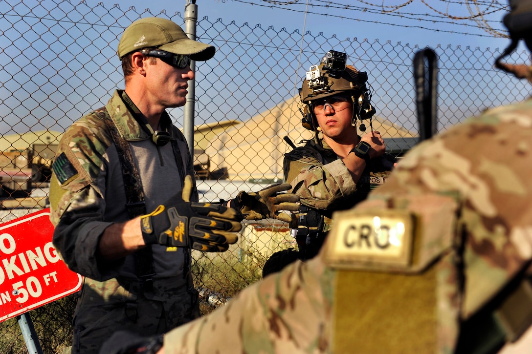 U.S. Air Force Master Sgt. Ryan Darnell, left, briefs U.S. Air Force ...