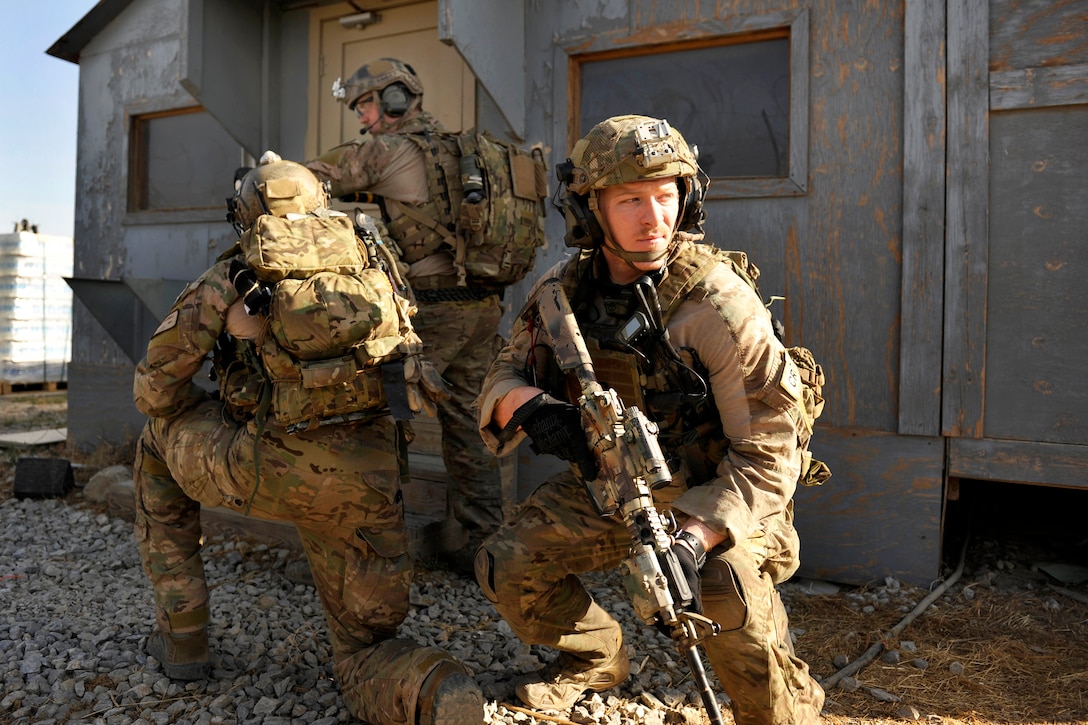 U.S. Air Force Capt. Cameron Rochelle, right, watches for potential ...