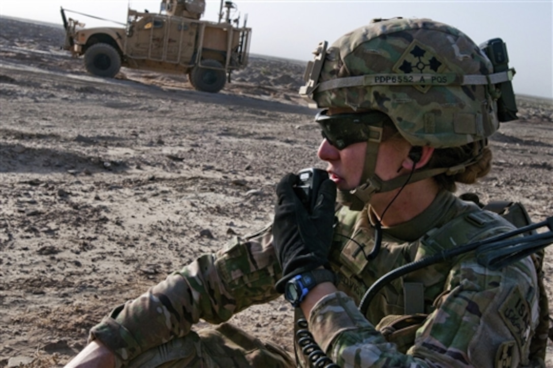 U.S. Army 1st Lt. Elyse Ping Medvigy conducts calls for fire during artillery training on Kandahar Airfield, Afghanistan, Aug. 22, 2014. Medvigy is a fire support officer assigned to the 4th Infantry Division's Company D, 1st Battalion, 12th Infantry Regiment, 4th Inf. Brigade Combat Team.