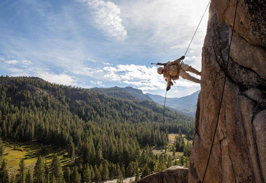 U.S. Marine Lance Cpl. Julio C. Miranda Jr. rappels down a cliff during Mountain Exercise 2014 aboard Marine Corps Mountain Warfare Training Center in Bridgeport, Calif., Aug. 29, 2014. Miranda is an infantry rifleman with 3rd Platoon, Lima Company, 3rd Battalion, 1st Marine Regiment. Marines with 3rd Battalion, 1st Marine Regiment will become the 15th Marine Expeditionary Unit’s ground combat element in October. Mountain Exercise 2014 develops critical skills the battalion will need during deployment. (U.S. Marine Corps photo by Sgt. Emmanuel Ramos/Released)