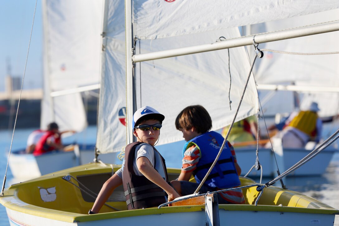 Dorian, left, Sebastian, right, together took first place in the culmination of the 2014 Summer Small Boat Race Series held at the Del Mar Marina here, Aug. 27.