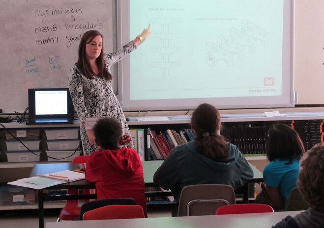 Elizabeth Stiles explains interior design concepts to students at the Academy of Academics and Art during STEM discussion August 28.