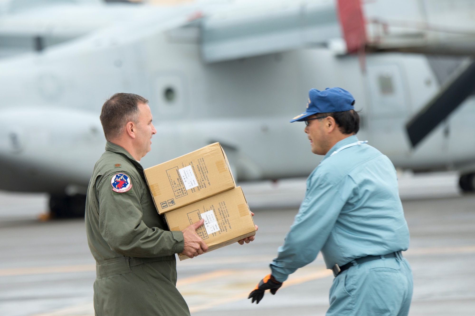 Maj. Destry Hill loads simulated relief supplies, Aug. 30, 2014, during the annual Tokyo Metropolitan Government Comprehensive Disaster Management Drill at Yokota Air Base, Japan. Yokota personnel practiced delivering simulated relief supplies to Ariake no Oka core wide-area disaster prevention base in downtown Tokyo.  Hill is a 5th Air Force UH-1N pilot. (U.S. Air Force photo/Osakabe Yasuo)