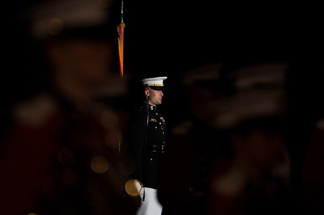 Capt. Jeffrey Clement, Marine Barracks Washington, D.C., parade adjutant, performs during a Friday Evening Parade at the Barracks, Aug. 29, 2014. (Official Marine Corps photo by Cpl. Dan Hosack/Released)