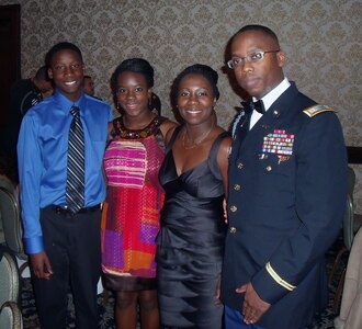 Photo courtesy of Toussaint family/Capt. Stephan Toussaint (right), assigned to the Headquarters, Headquarters Company, 33rd Infantry Brigade Combat Team and his wife Rosette (second from right) are both from Haiti and had family in the country at the time of the 7.0 magnitude earthquake last week. Both are scheduled to fly to Haiti next week to send relief and support to their family and friends. Here they are pictured with their children Xavier, 14 (left) and Jackie, 18 (second from left). The family lives in Decatur.