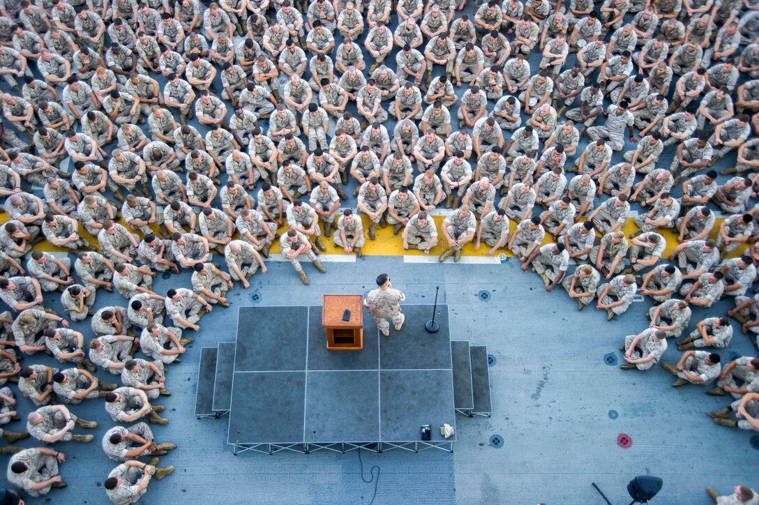 Colonel Romin Dasmalchi addresses the Marines and Sailors of the 31st Marine Expedtionary Unit aboard the USS Peleliu, September 2. The 31st MEU is conducting amphibious integration training aboard the ship as part of their reguarly scheduled fall patrol. Dasmalchi is the commanding officer of the 31st MEU.