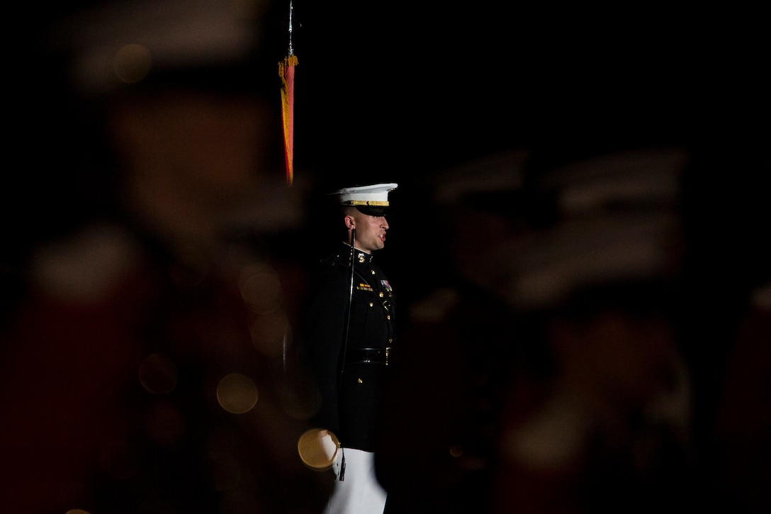 Capt. Jeffrey Clement, Marine Barracks Washington, D.C., parade adjutant, performs during a Friday Evening Parade at the Barracks, Aug. 29, 2014. (Official Marine Corps photo by Cpl. Dan Hosack/Released)