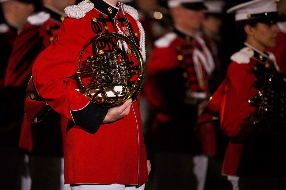 A member of the U.S. Marine Band performs during a Friday Evening Parade at Marine Barracks Washington, D.C., Aug. 29, 2014. (Official Marine Corps photo by Cpl. Dan Hosack/Released)